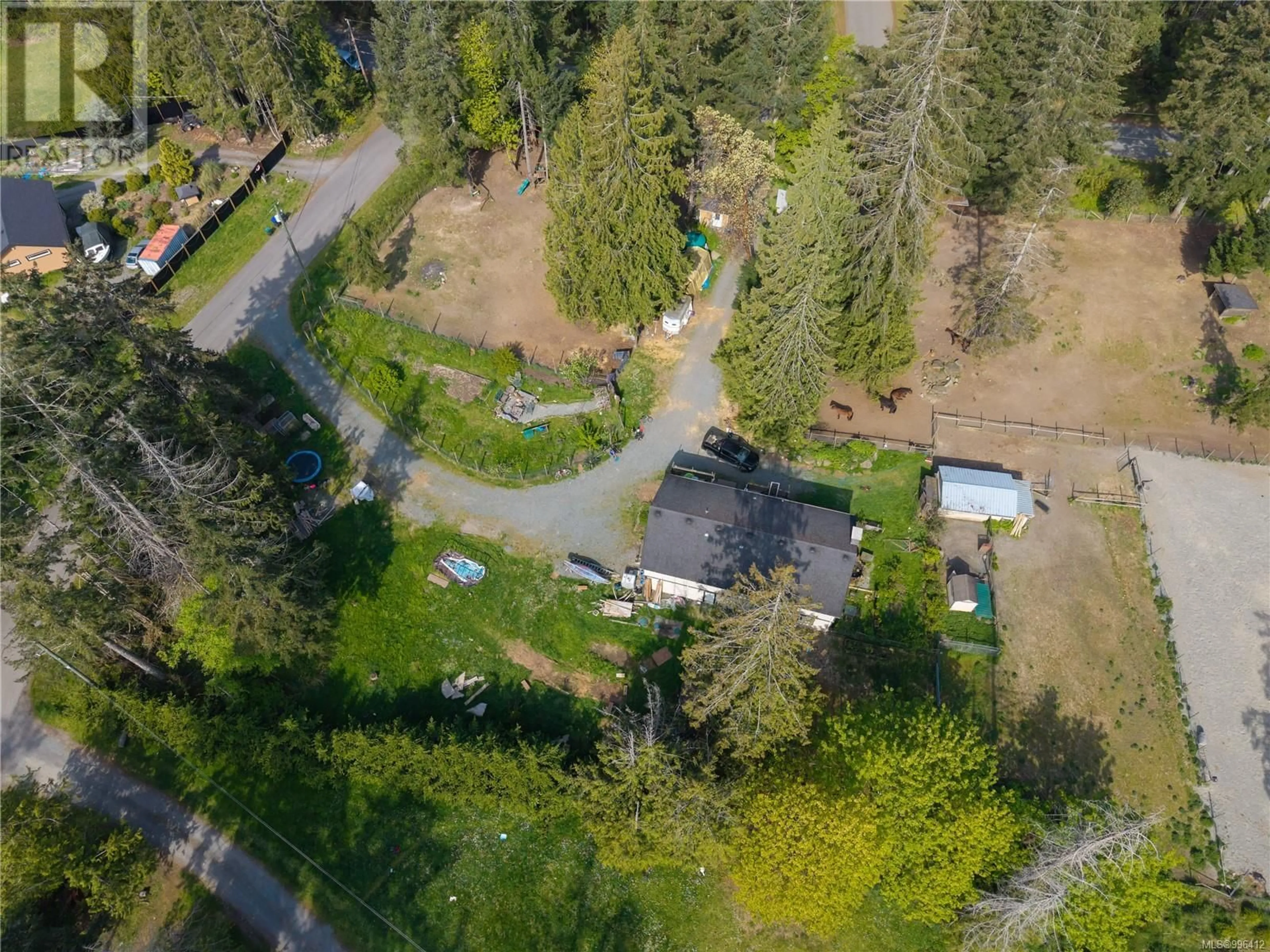 A pic from outside/outdoor area/front of a property/back of a property/a pic from drone, forest/trees view for 3455 MCGUIRE WAY, Nanaimo British Columbia V9G1C4