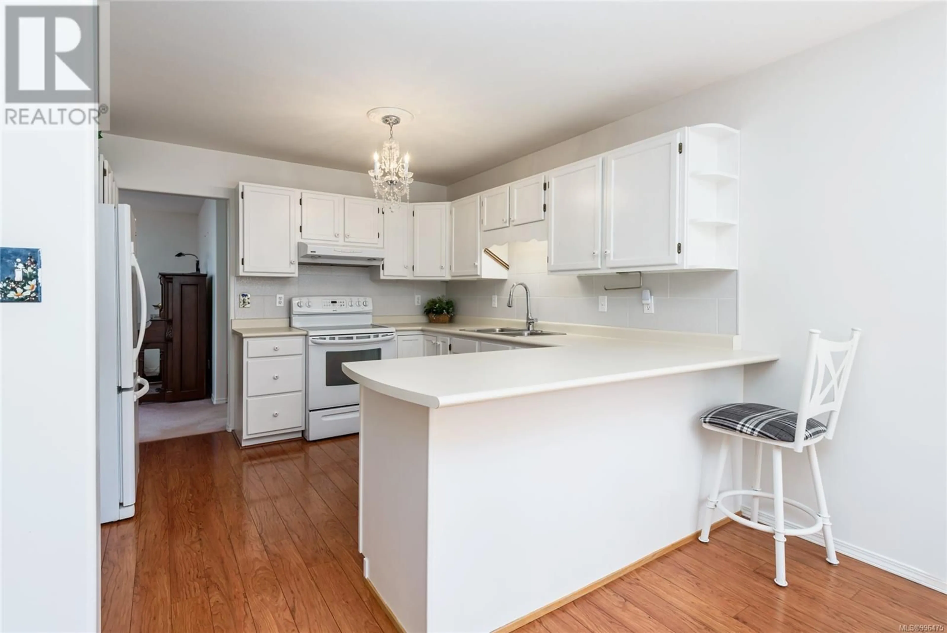 Open concept kitchen, wood/laminate floor for 1008 KINGSLEY CRESCENT, Comox British Columbia V9M3R7