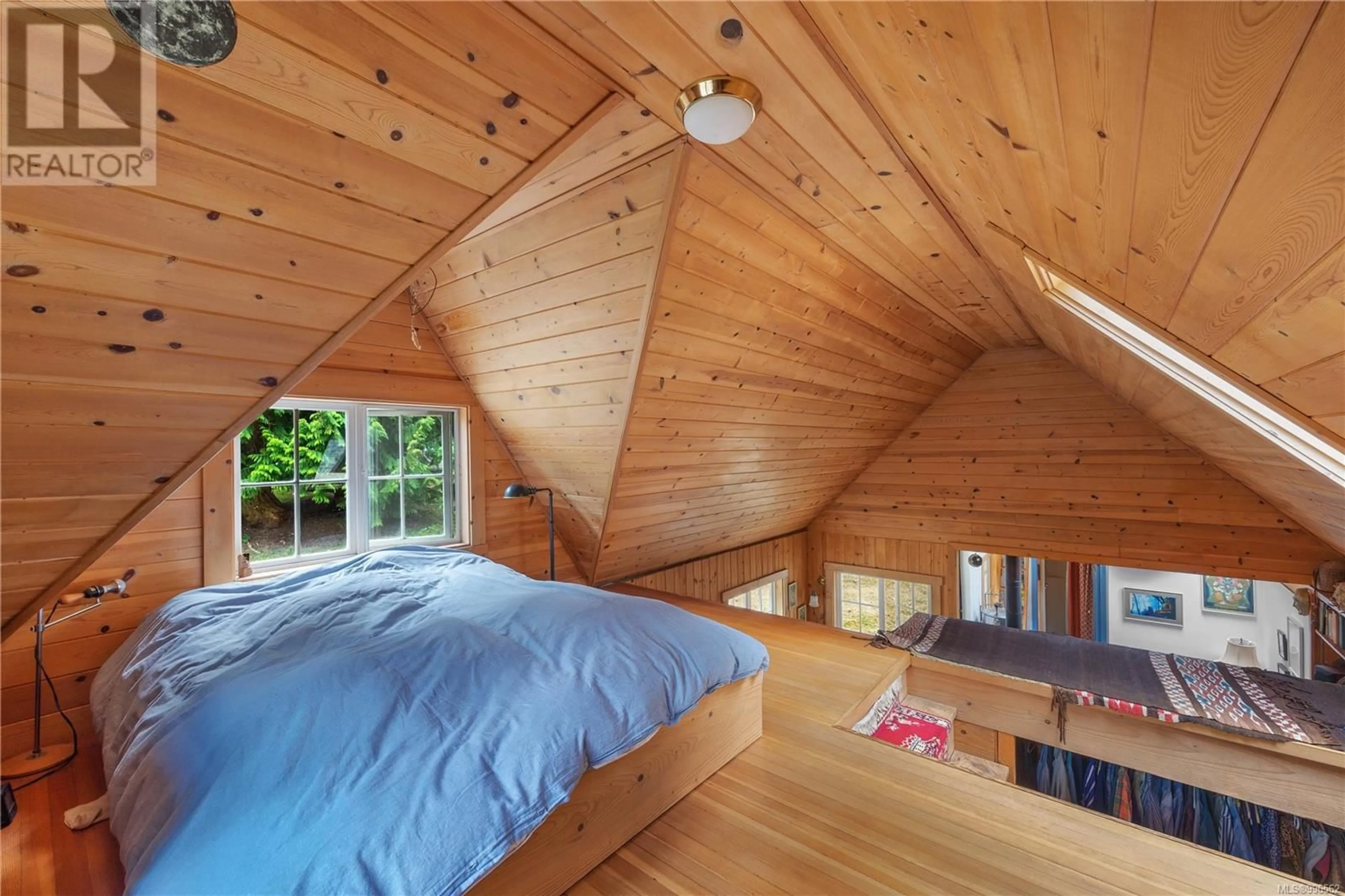 Bedroom with bed, wood/laminate floor for 10 WINDHAM ROAD, Lasqueti Island British Columbia V0R2J0