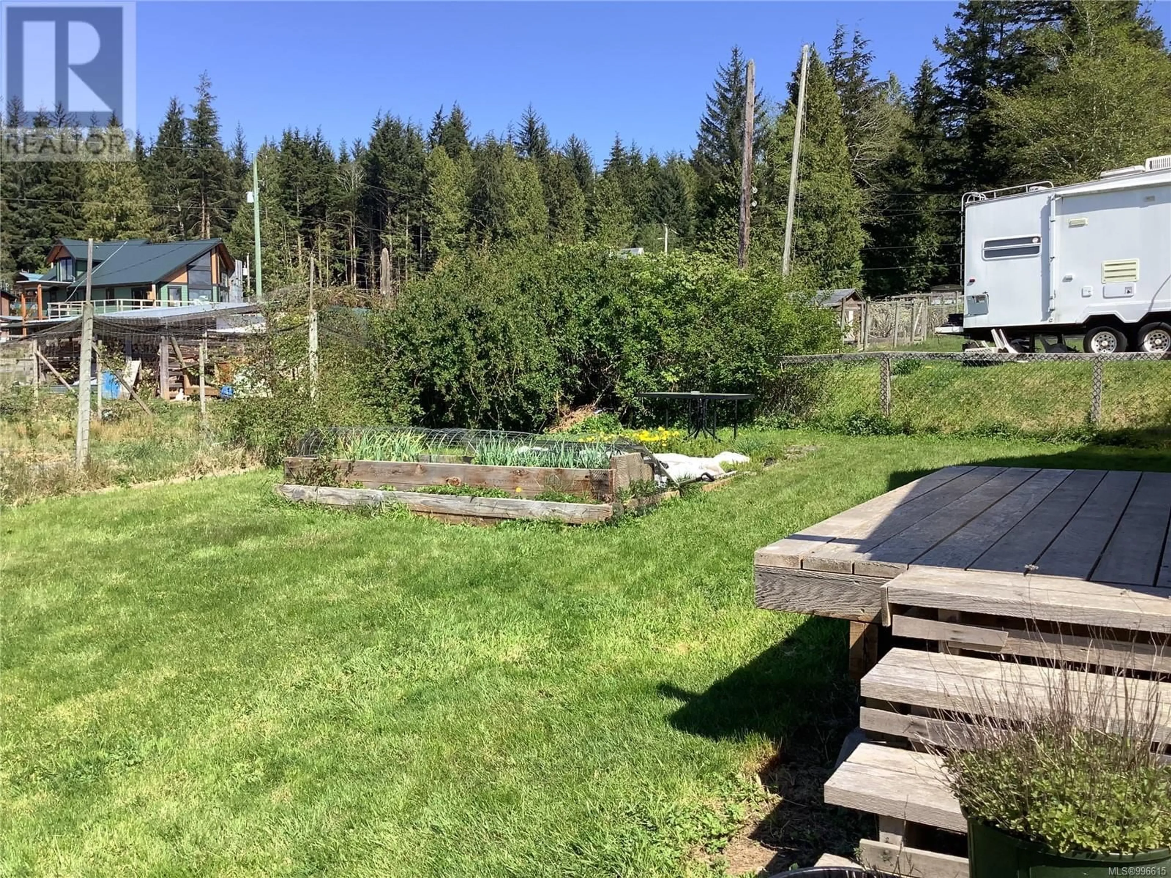 A pic from outside/outdoor area/front of a property/back of a property/a pic from drone, forest/trees view for 320 16TH AVENUE, Sointula British Columbia V0N3E0
