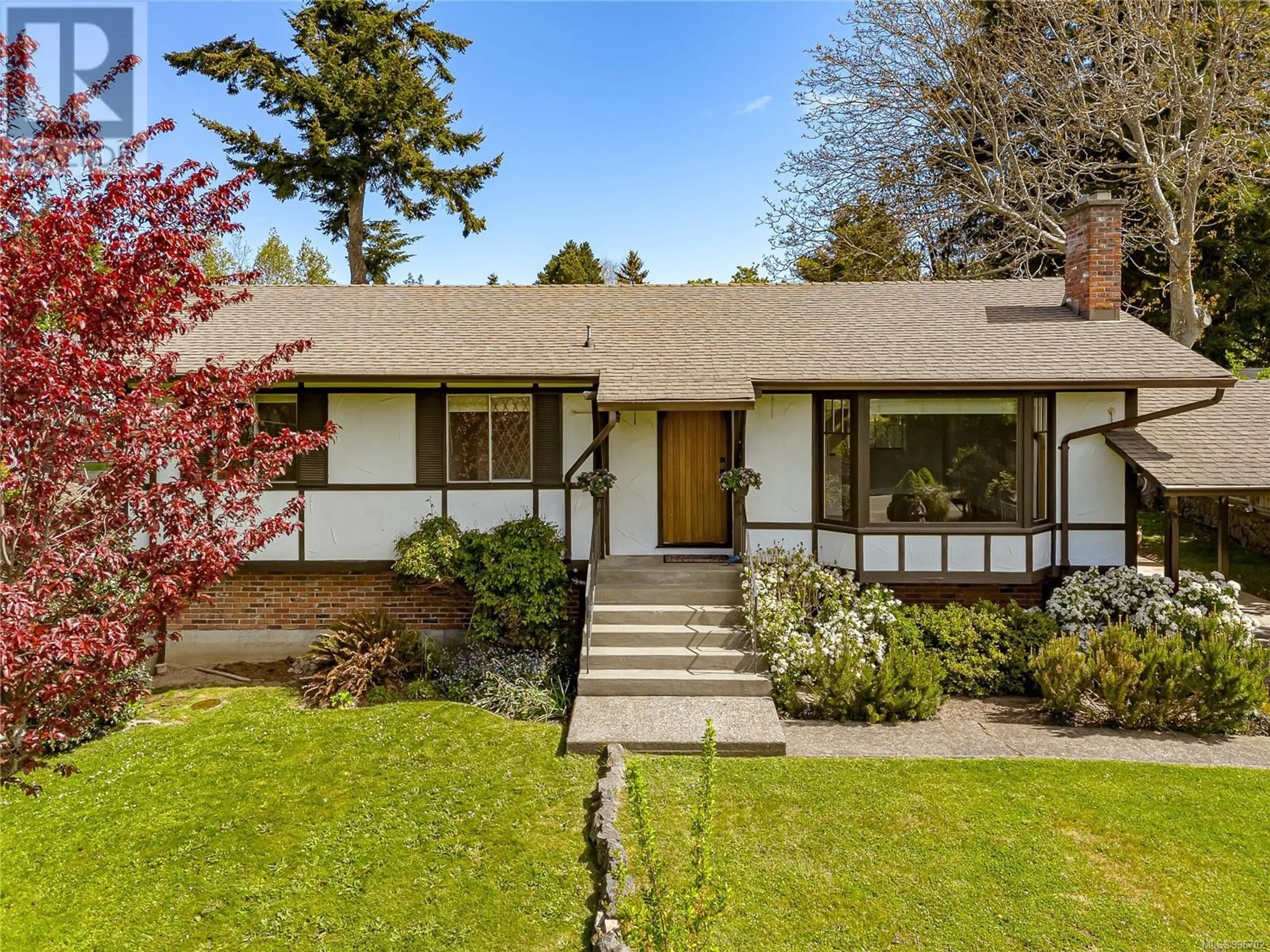 Home with brick exterior material, street for 3928 CADBORO BAY ROAD, Saanich British Columbia V8N4G9