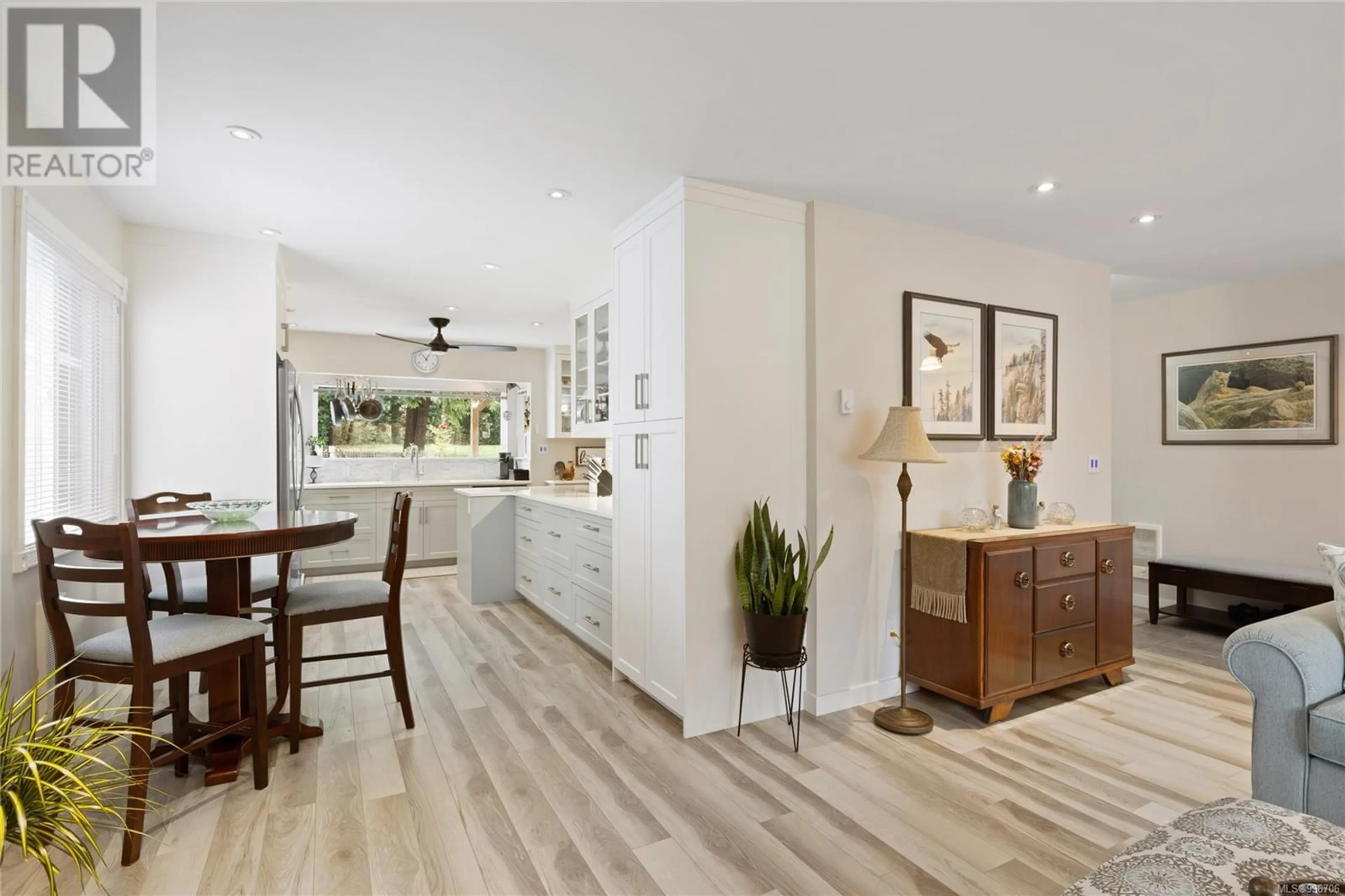 Open concept kitchen, wood/laminate floor for 1592 BEAVER CREEK WHARF ROAD, Nanoose Bay British Columbia V9P9C4