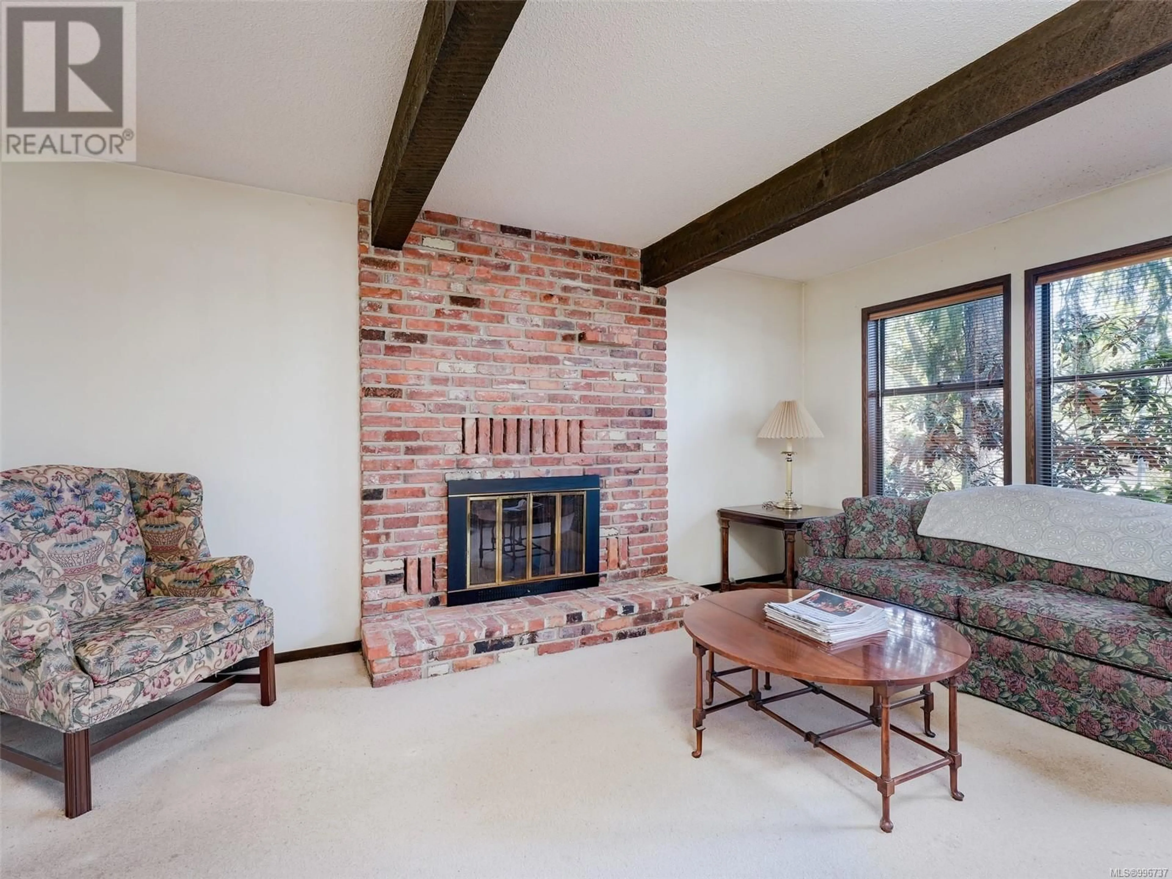 Living room with furniture, ceramic/tile floor for 1249 GARRY OAK PLACE, Saanich British Columbia V8P5N1