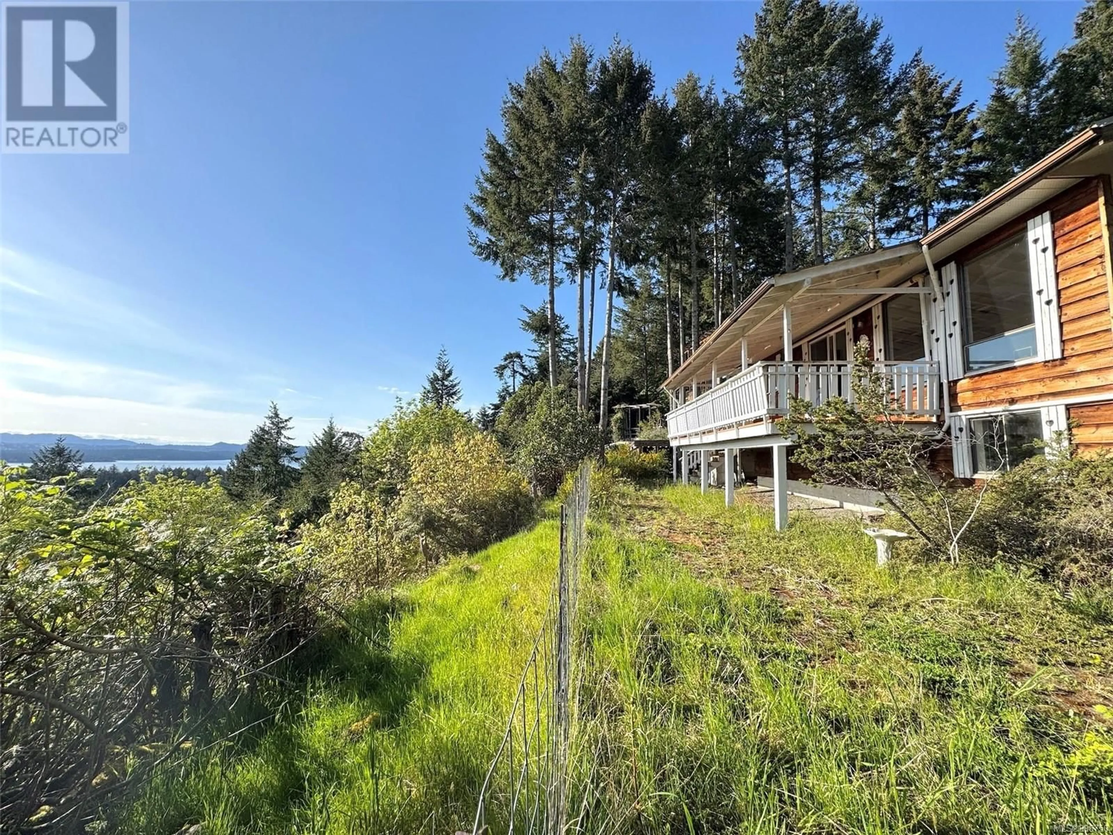 A pic from outside/outdoor area/front of a property/back of a property/a pic from drone, water/lake/river/ocean view for 955 PAT BURNS AVENUE, Gabriola Island British Columbia V0R1X2