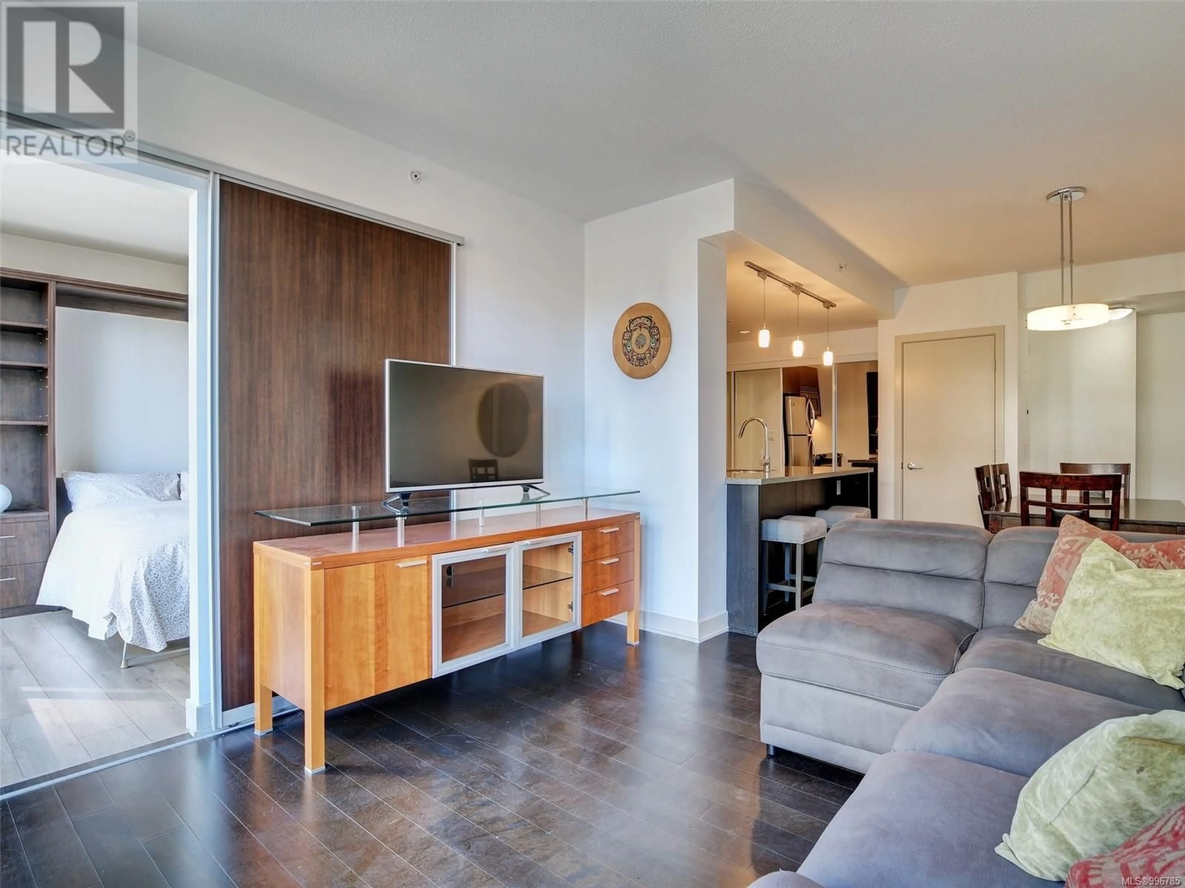 Living room with furniture, wood/laminate floor for 212 - 760 JOHNSON STREET, Victoria British Columbia V8W0A4