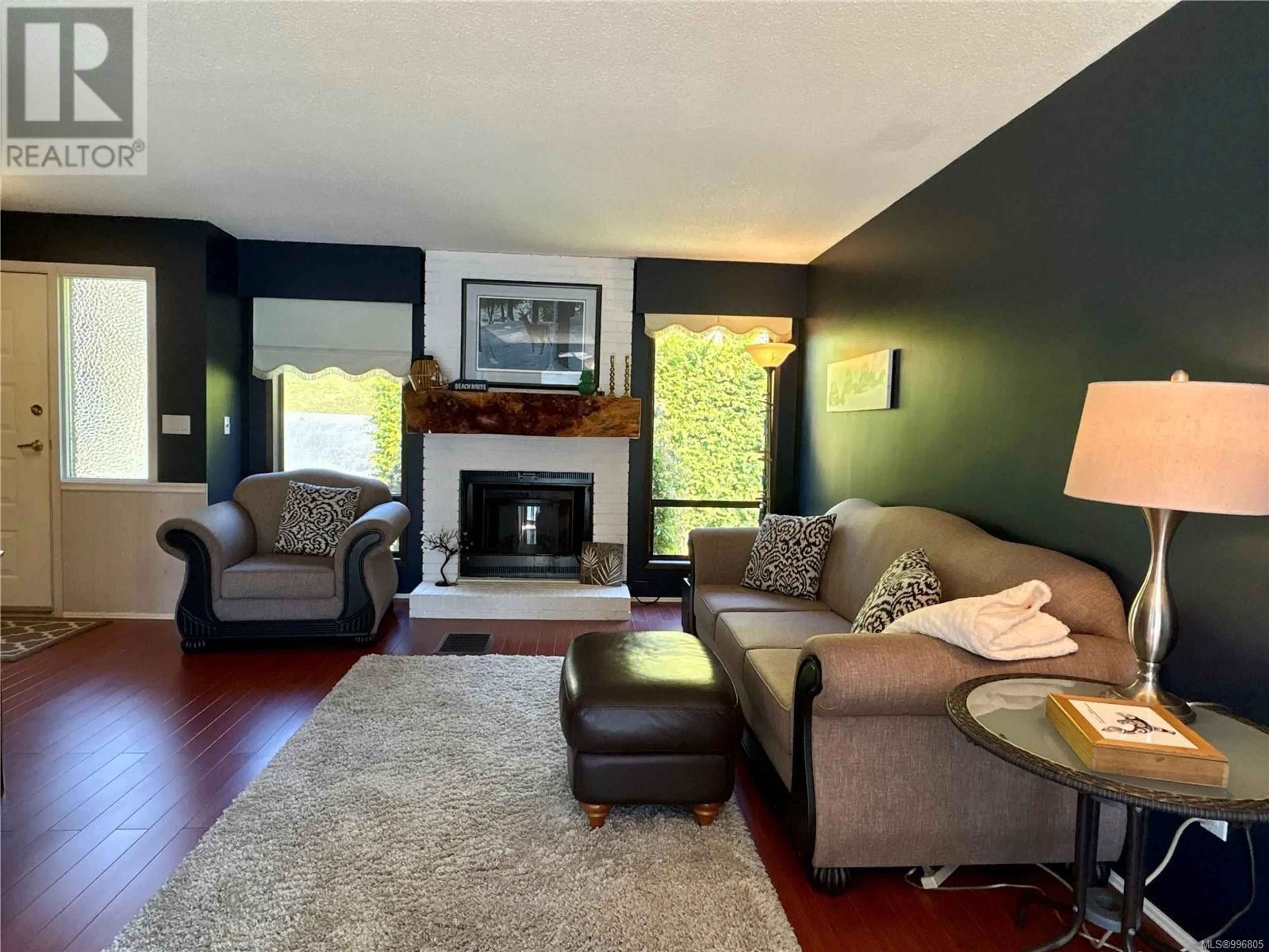 Living room with furniture, wood/laminate floor for 1200 MARINE DRIVE, Port Alice British Columbia V0N2N0