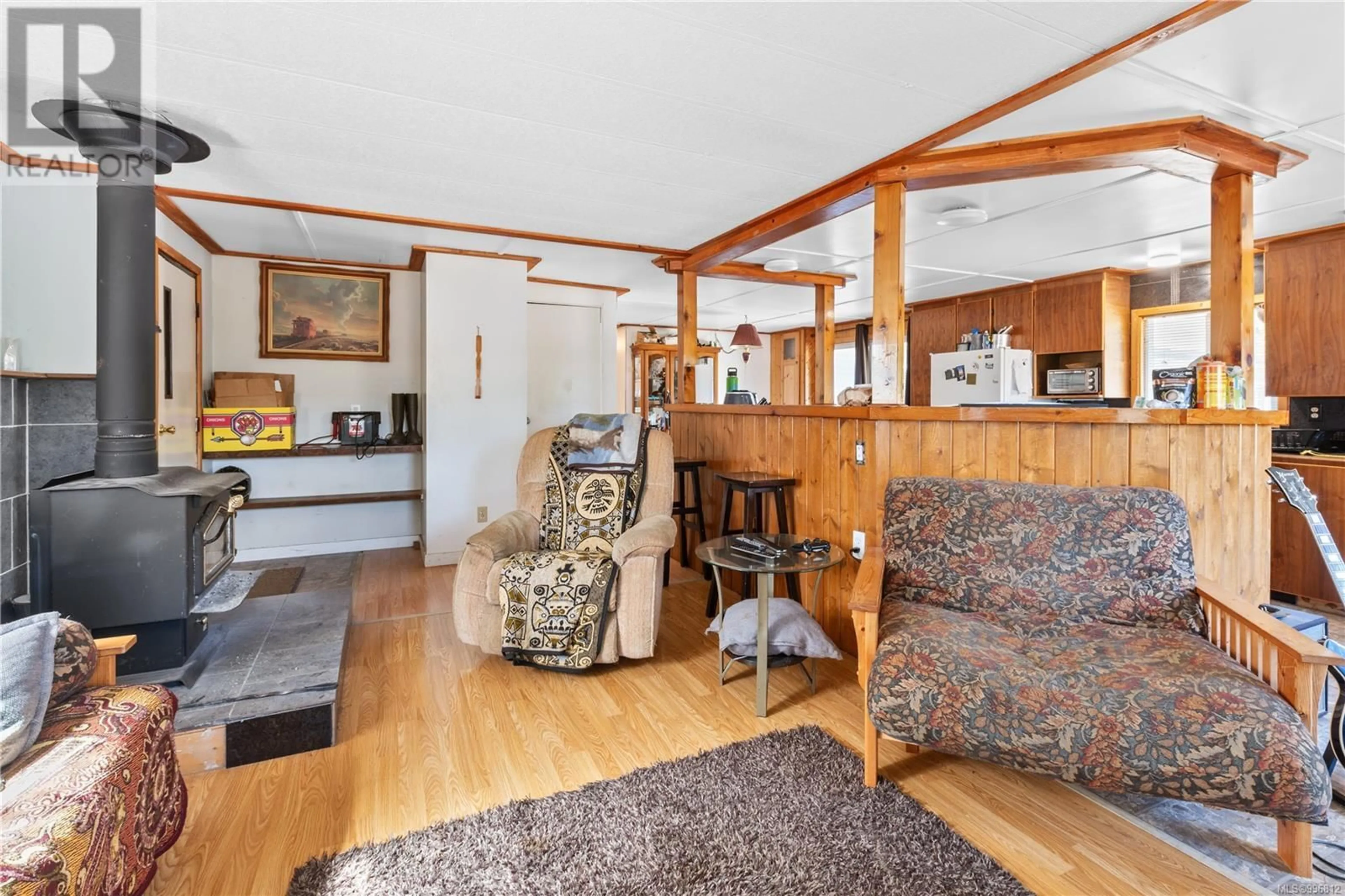 Living room with furniture, wood/laminate floor for 288 ALBION CRESCENT, Ucluelet British Columbia V0R3A0