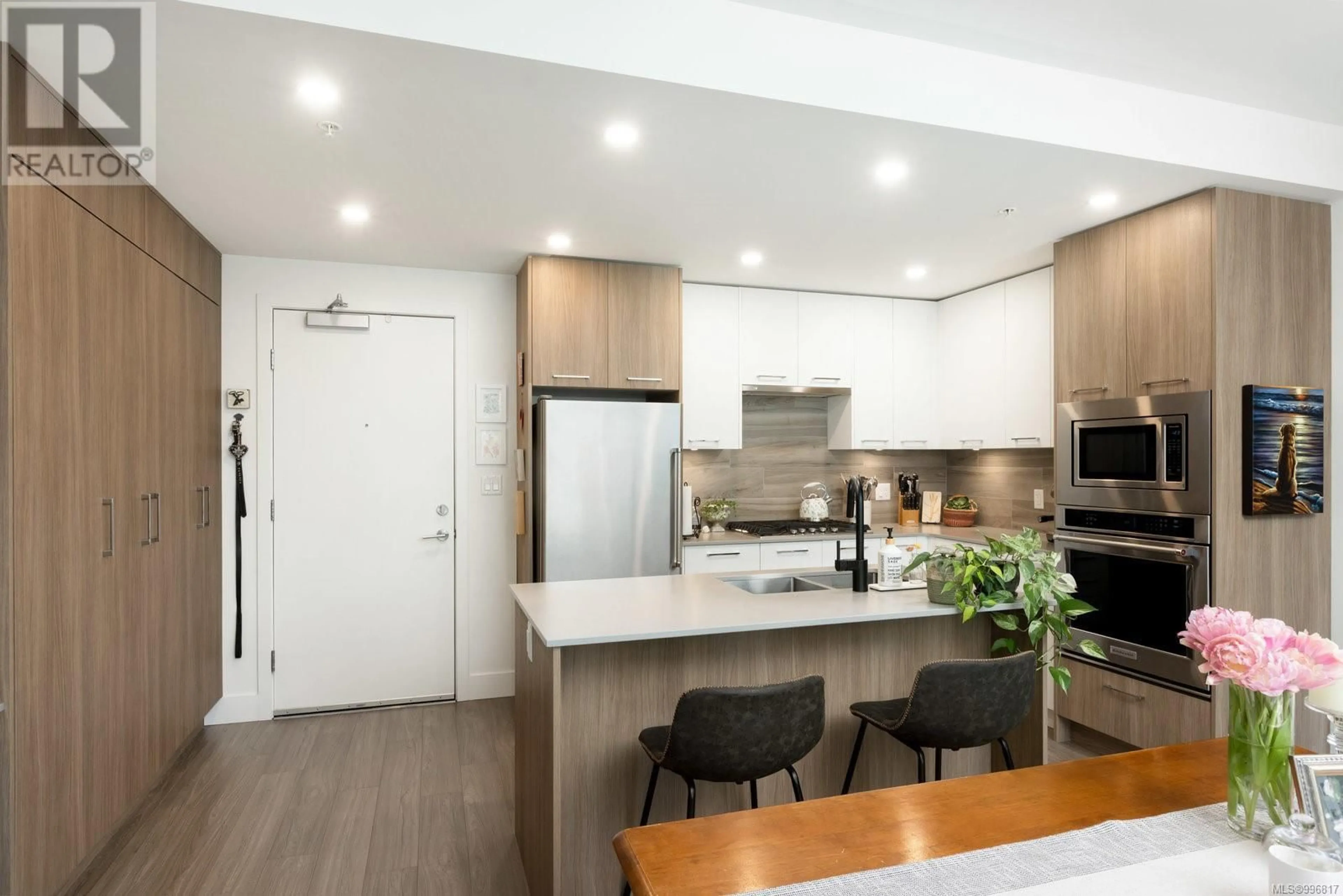 Open concept kitchen, wood/laminate floor for 405 - 960 REUNION AVENUE, Langford British Columbia V9B0W5