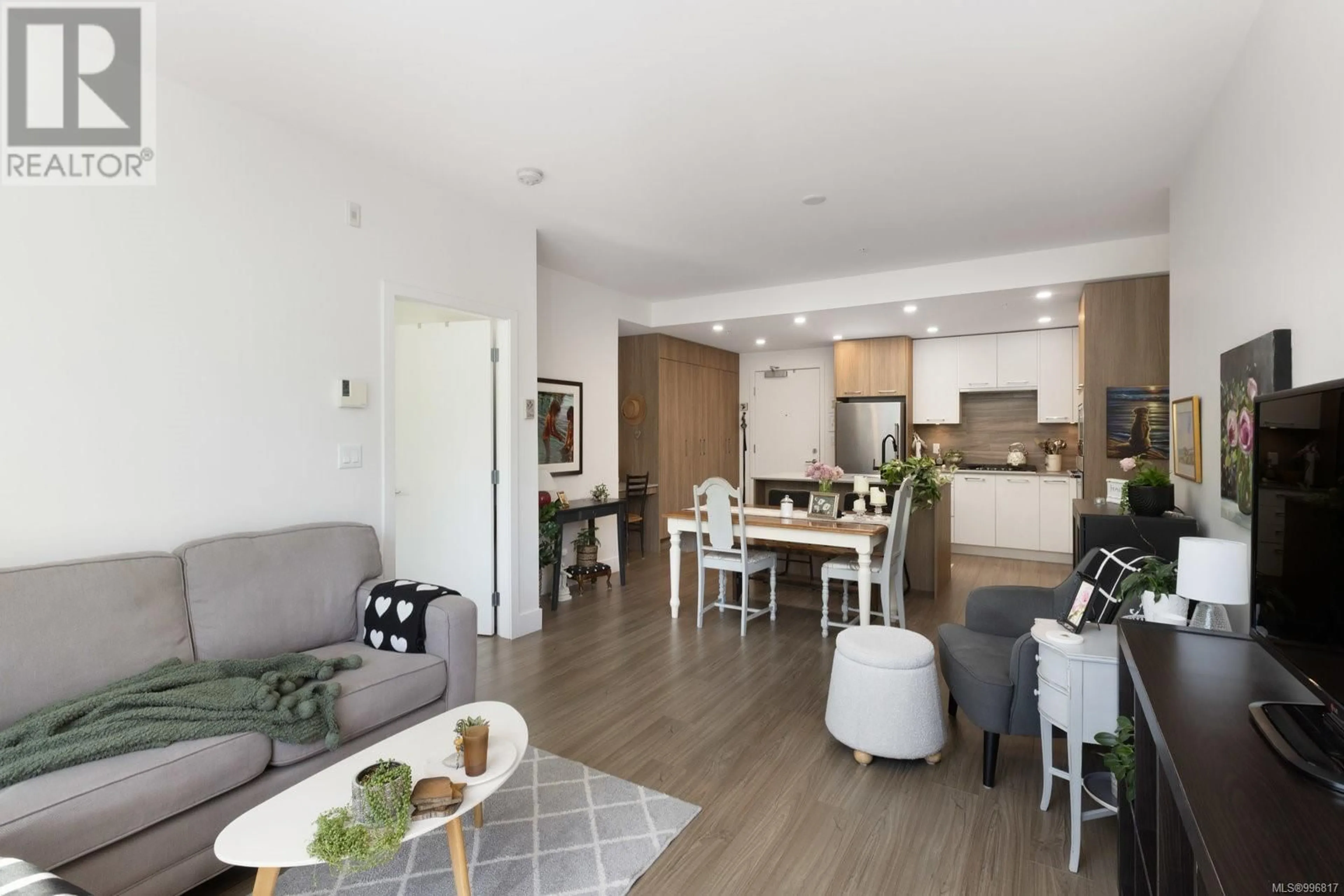 Living room with furniture, wood/laminate floor for 405 - 960 REUNION AVENUE, Langford British Columbia V9B0W5