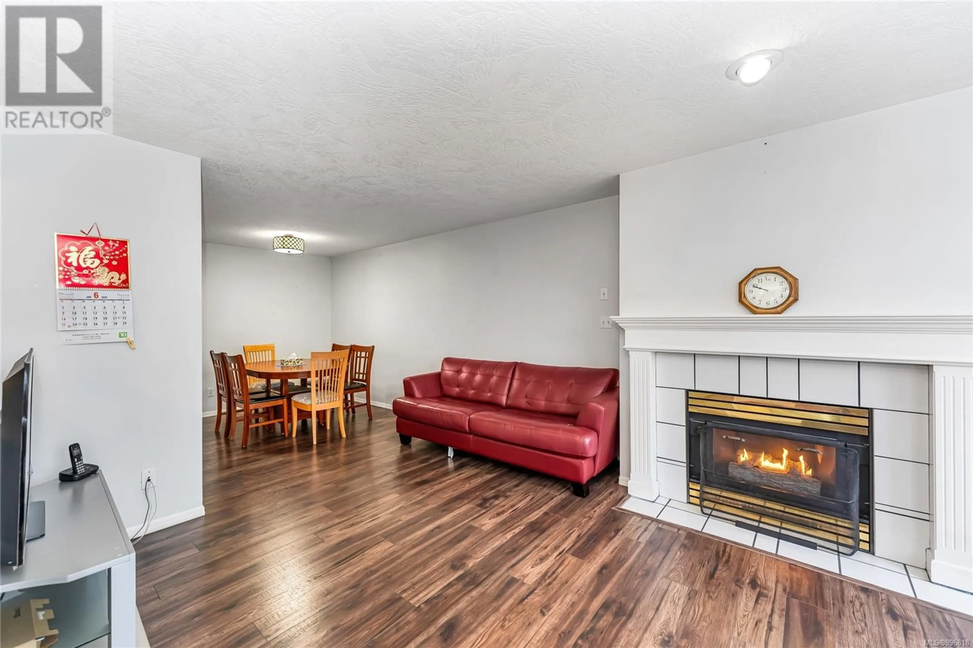 Living room with furniture, wood/laminate floor for 309 - 898 VERNON AVENUE, Saanich British Columbia V8X2W6