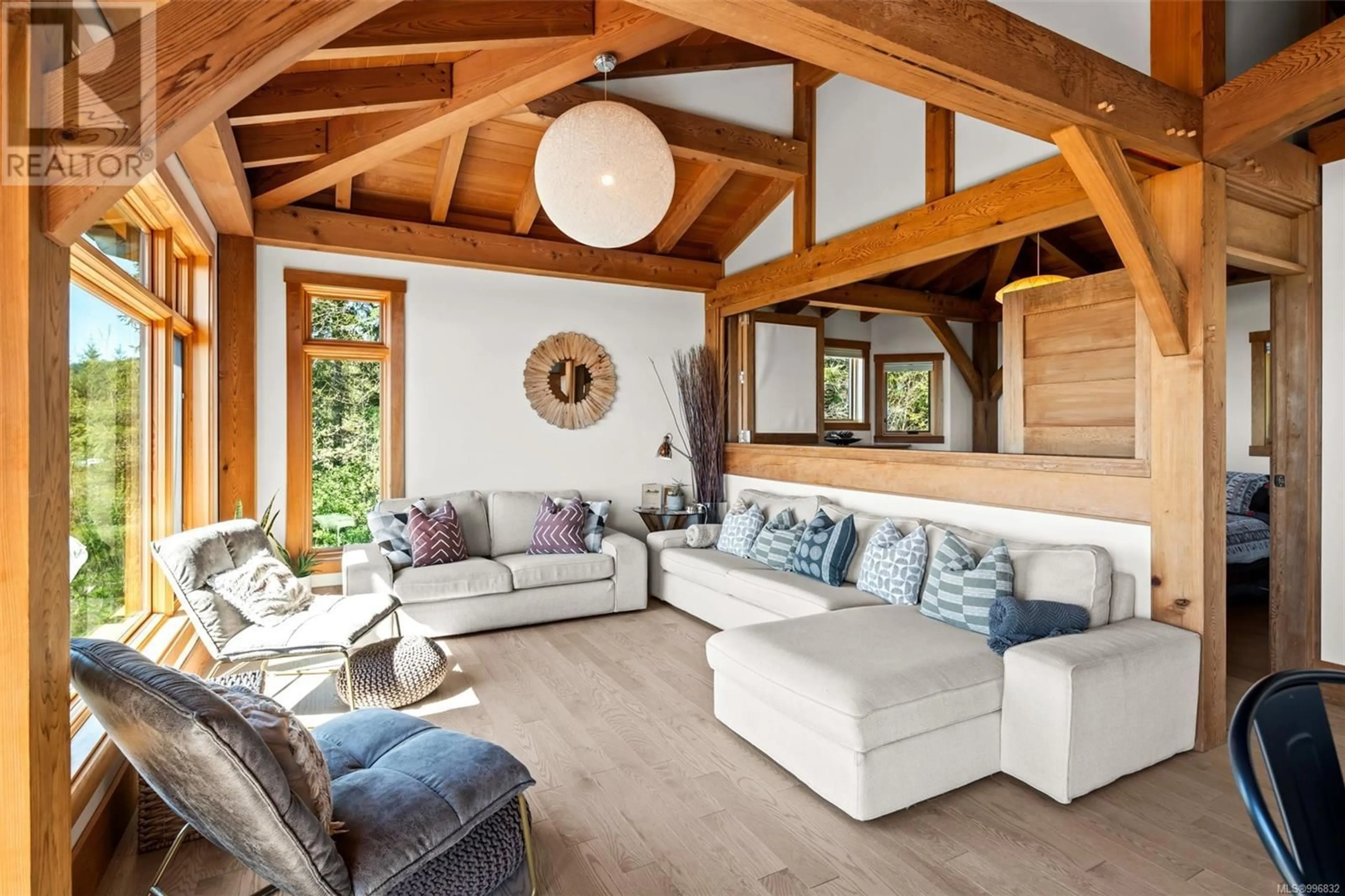 Living room with furniture, wood/laminate floor for 3926 TIMBERLINE WAY, Sooke British Columbia V9Z1L1