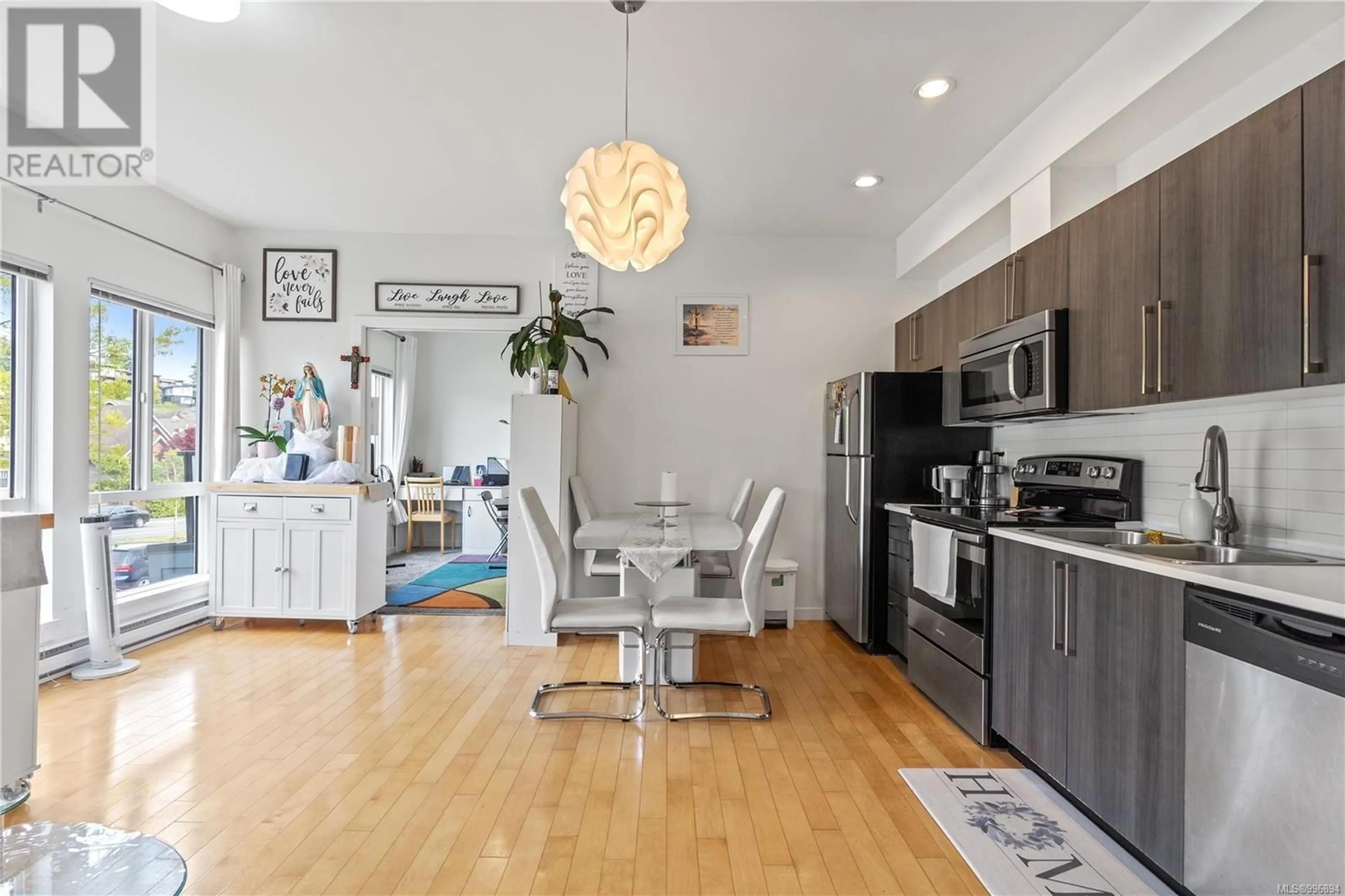 Open concept kitchen, wood/laminate floor for 207 - 4050 DOUGLAS STREET, Saanich British Columbia V8X0A5