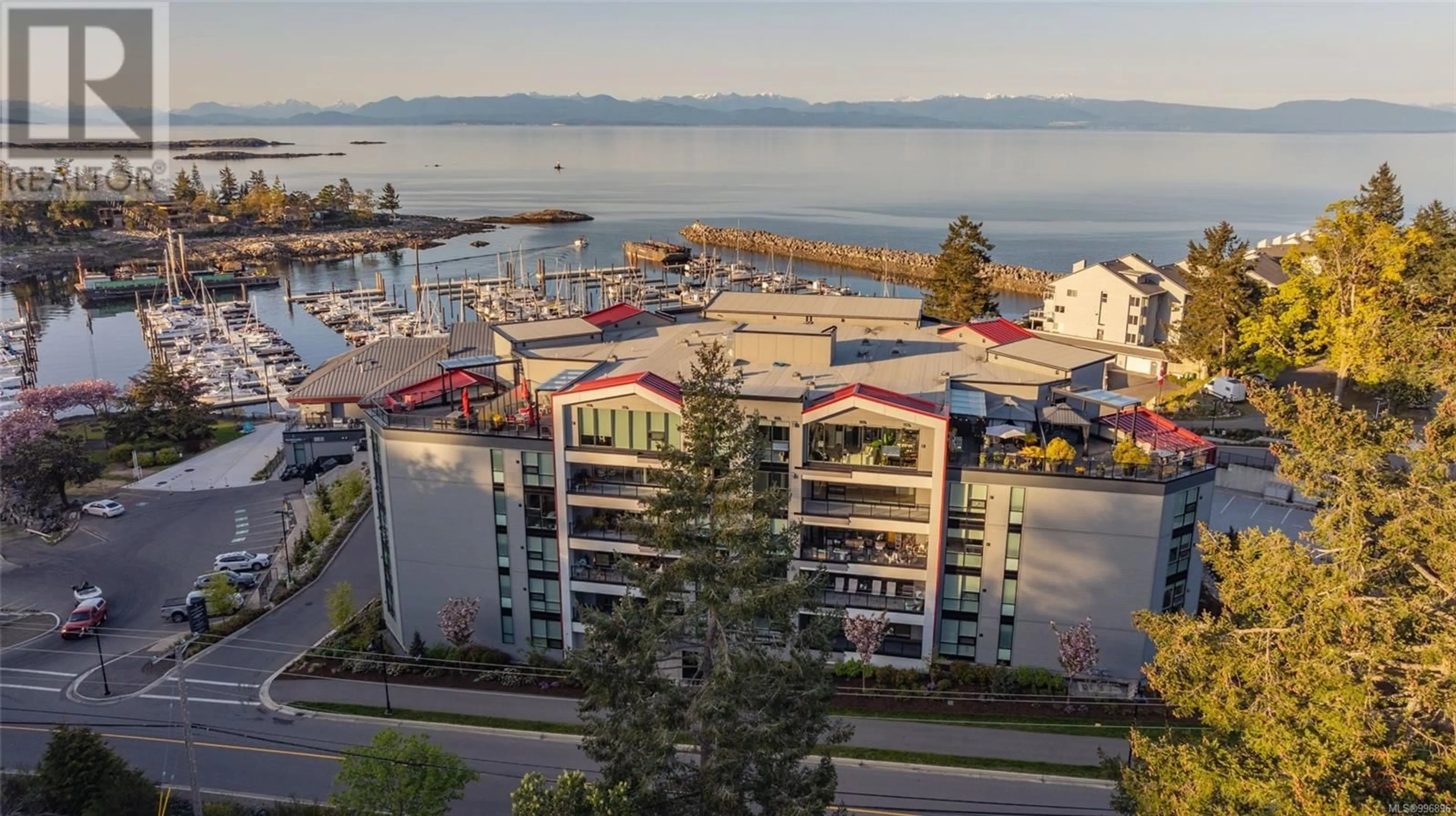 A pic from outside/outdoor area/front of a property/back of a property/a pic from drone, water/lake/river/ocean view for 605 - 3529 DOLPHIN DRIVE, Nanoose Bay British Columbia V9P9J7