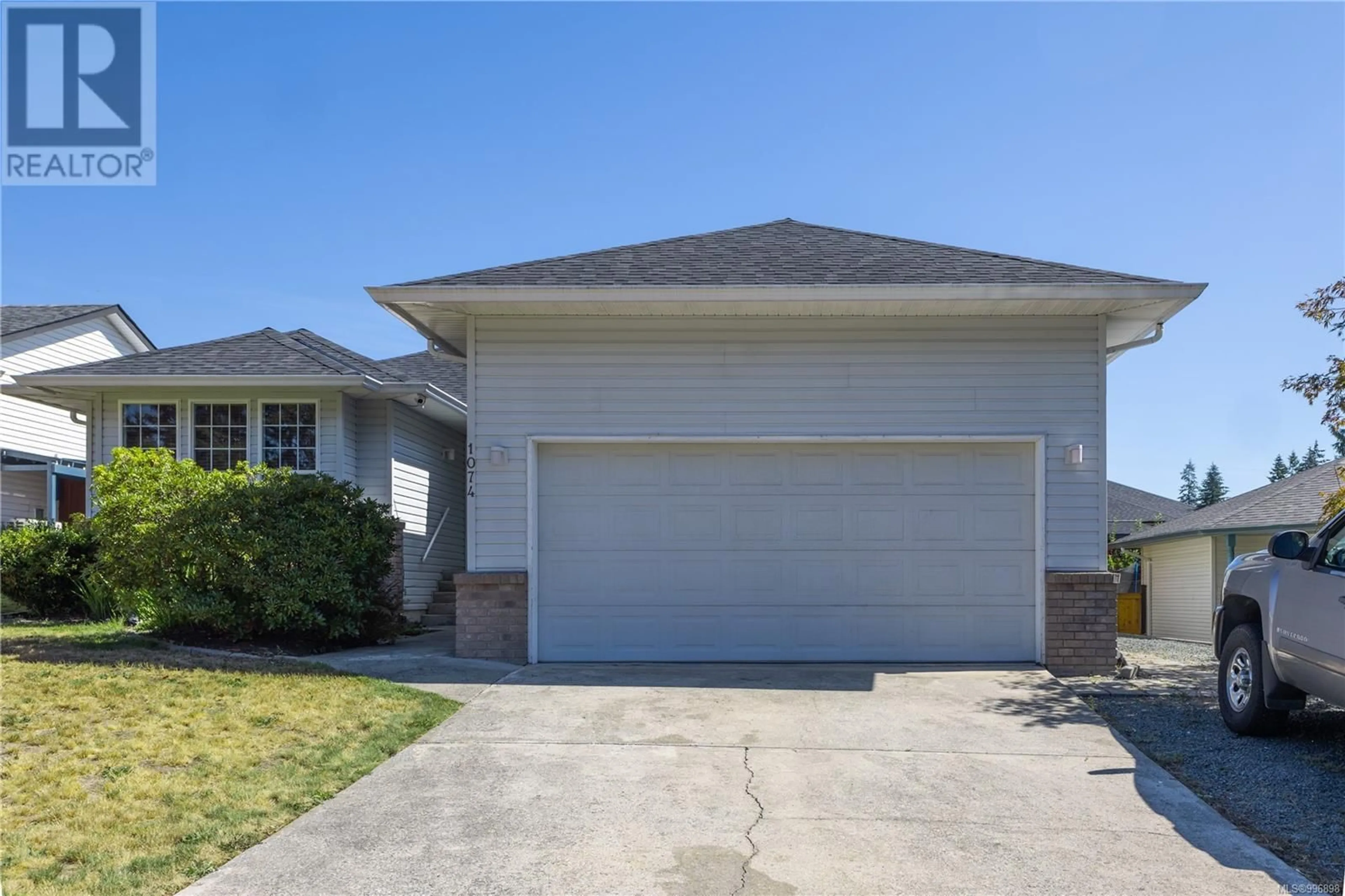 Home with vinyl exterior material, street for 1074 SPRINGBOK ROAD, Campbell River British Columbia V9W7K7