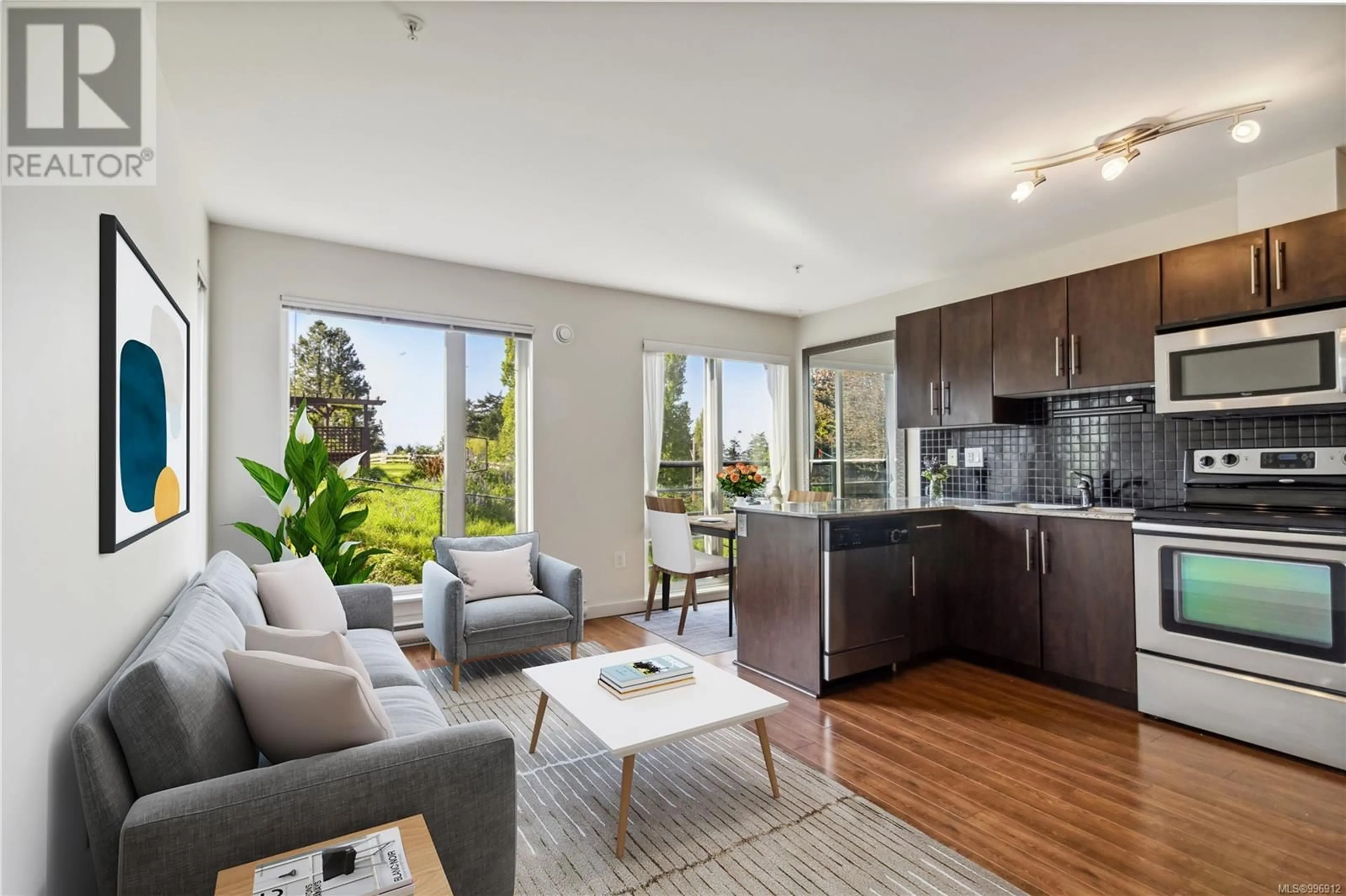 Living room with furniture, wood/laminate floor for 308 - 1405 ESQUIMALT ROAD, Esquimalt British Columbia V9A0A4