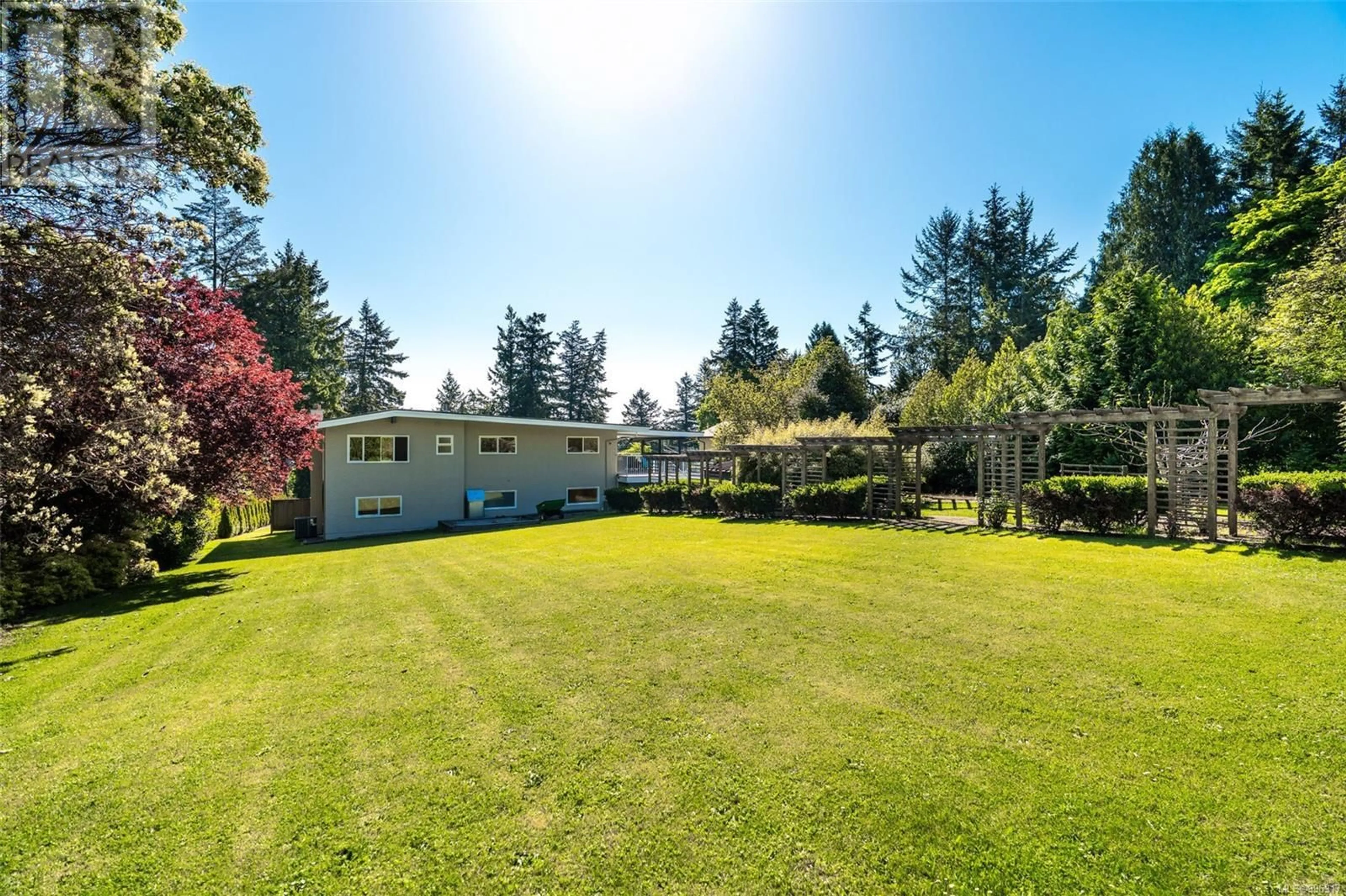 A pic from outside/outdoor area/front of a property/back of a property/a pic from drone, water/lake/river/ocean view for 8564 MOXON TERRACE, North Saanich British Columbia V8L1K6