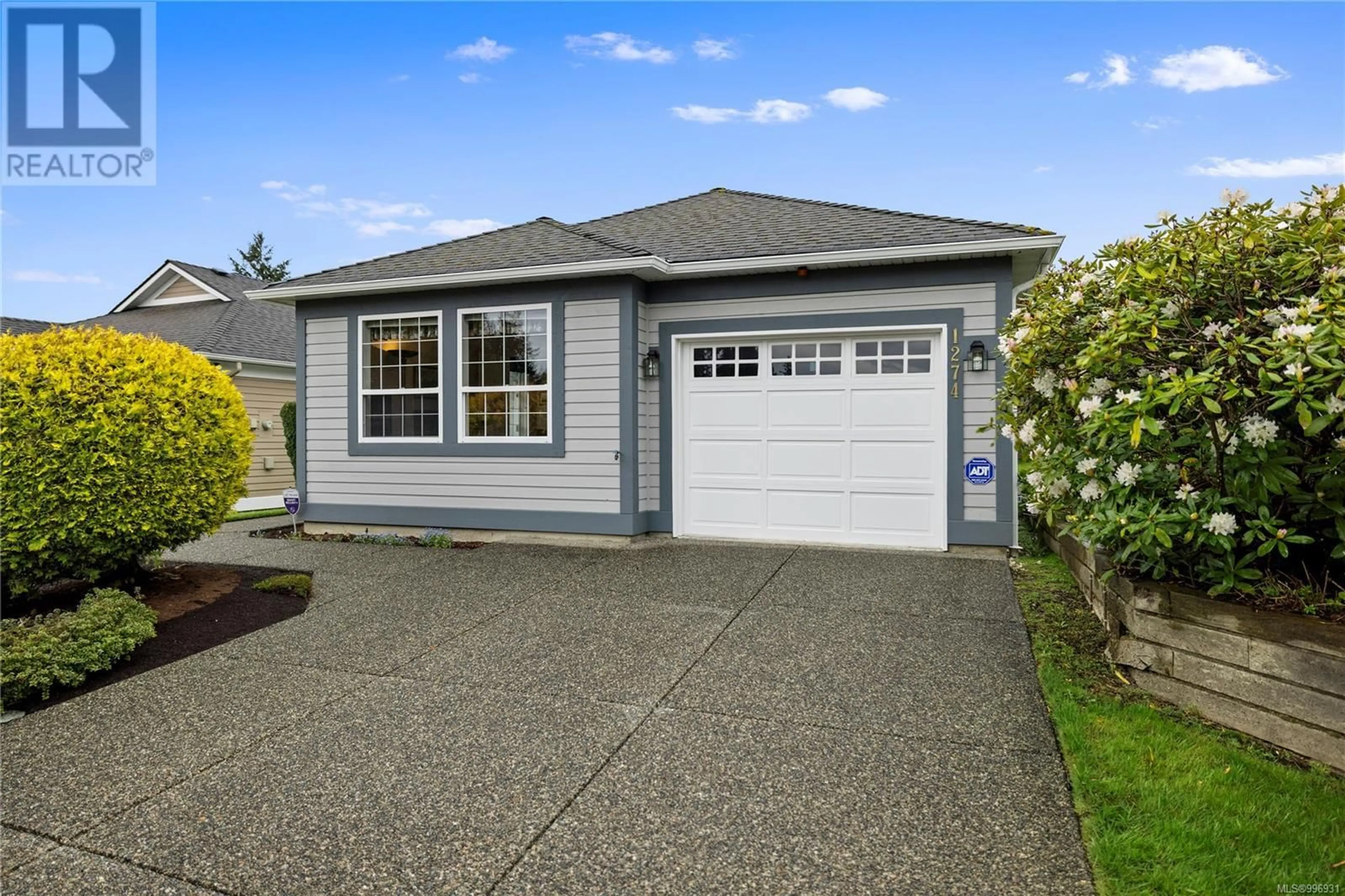 Home with vinyl exterior material, street for 1274 OCEANSIDE DRIVE, Qualicum Beach British Columbia V9K1T8