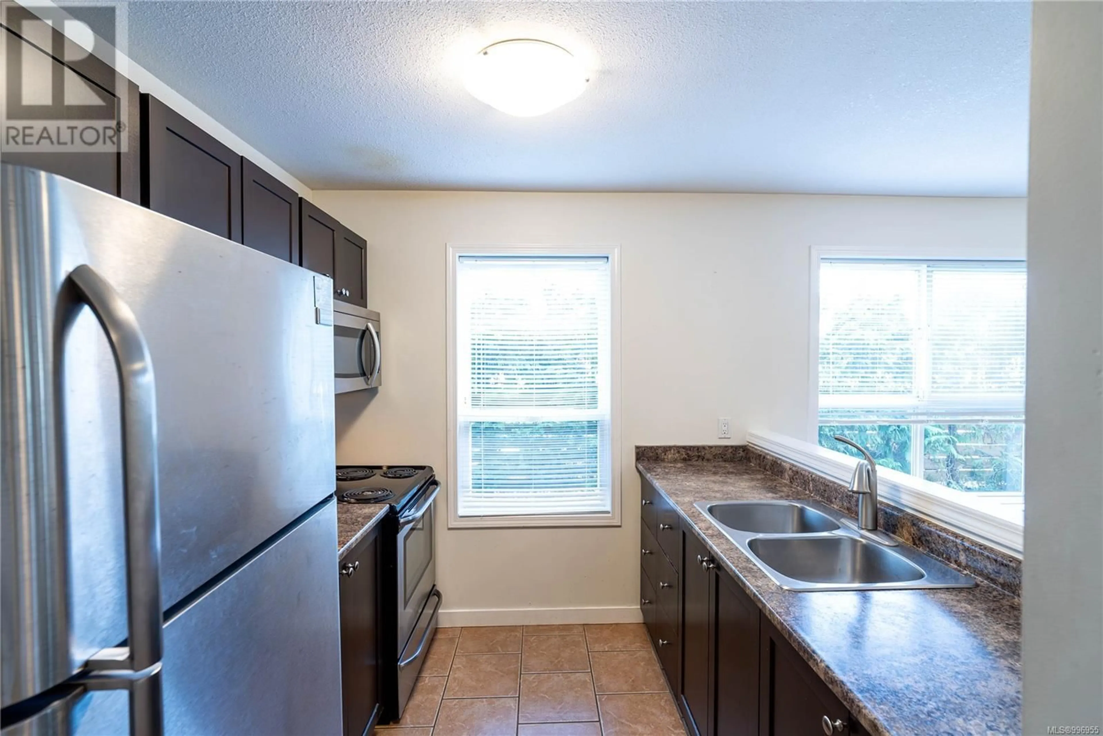 Standard kitchen, ceramic/tile floor for 103 - 690 THIRD STREET, Nanaimo British Columbia V9R1W8