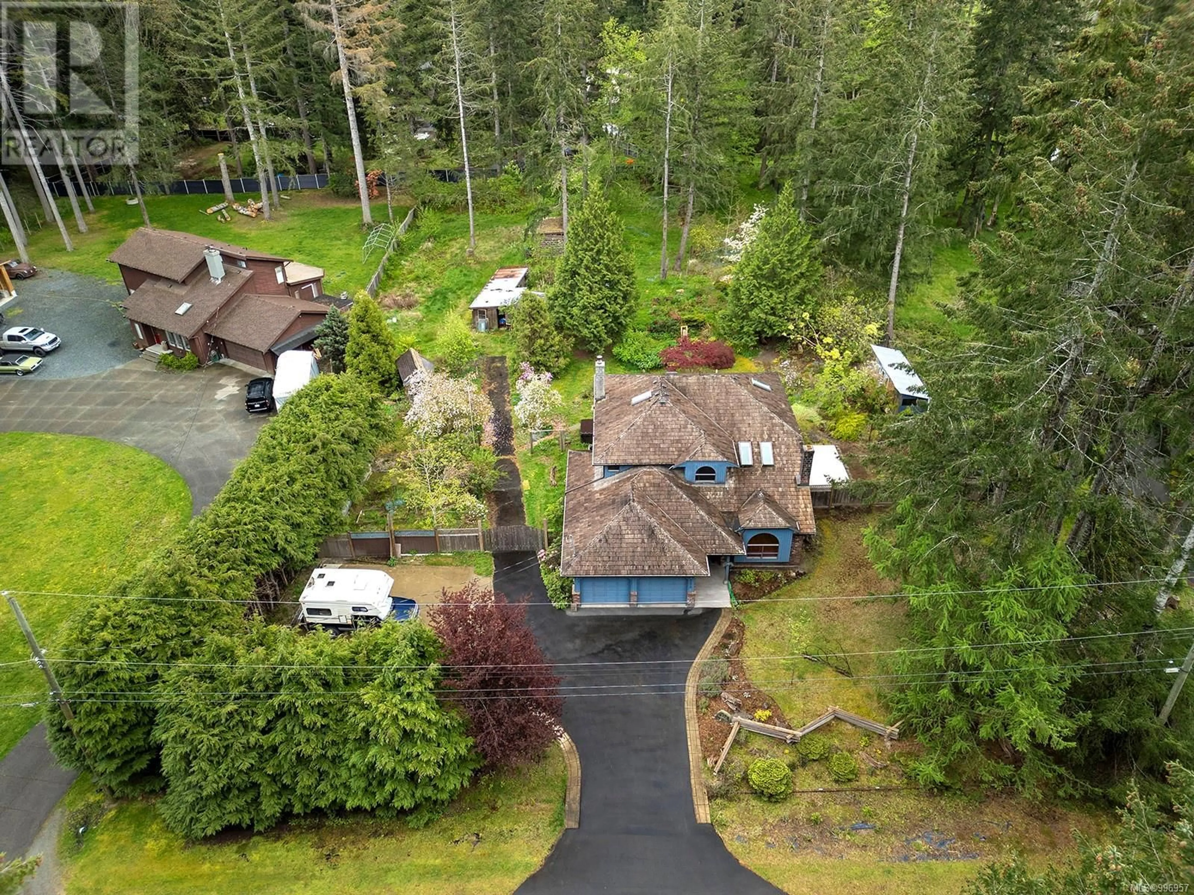 A pic from outside/outdoor area/front of a property/back of a property/a pic from drone, forest/trees view for 2373 ELMO ROAD, Courtenay British Columbia V9J1S4