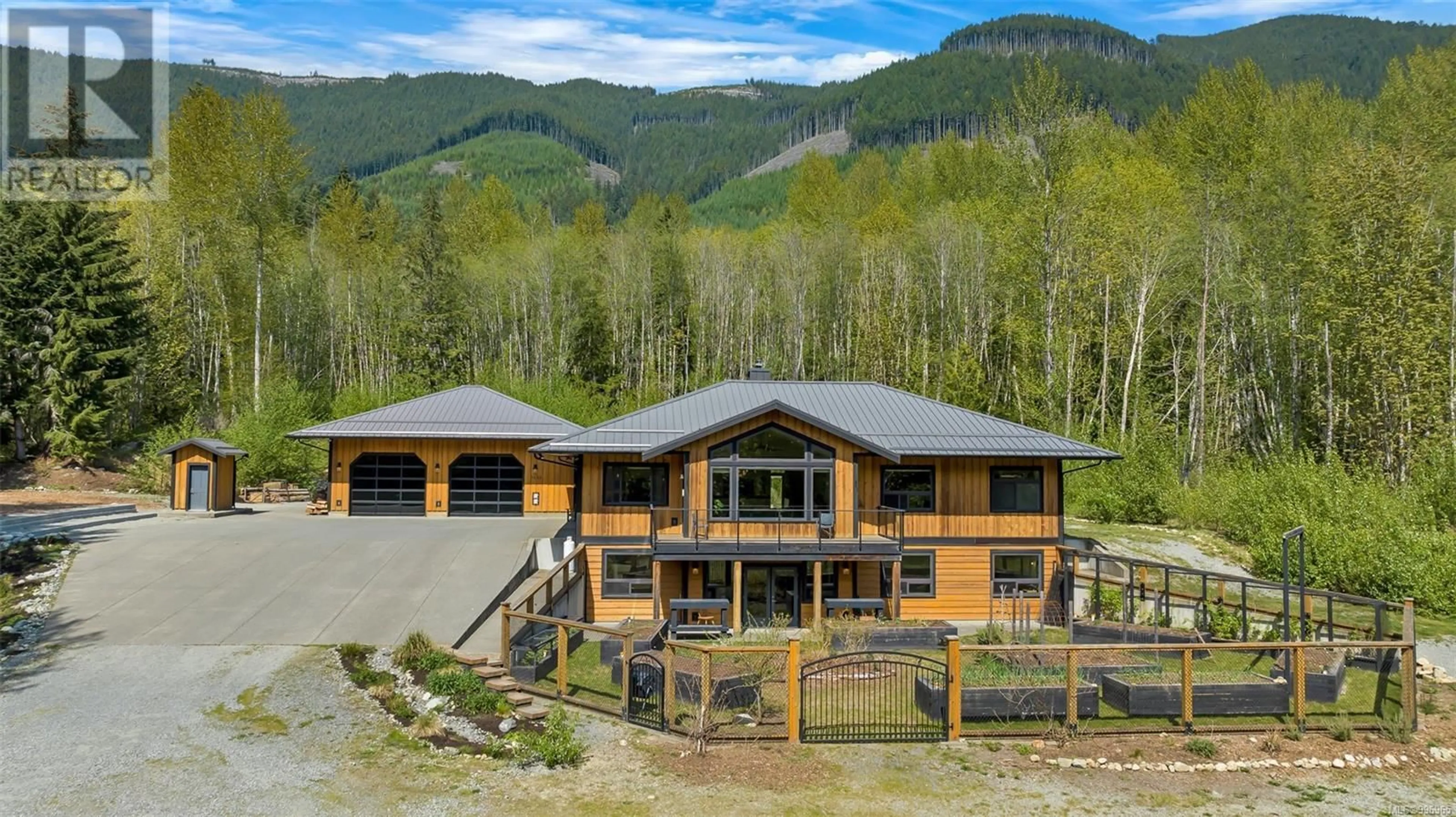 A pic from outside/outdoor area/front of a property/back of a property/a pic from drone, mountain view for 7695 COWICHAN LAKE ROAD, Lake Cowichan British Columbia V0R2G0