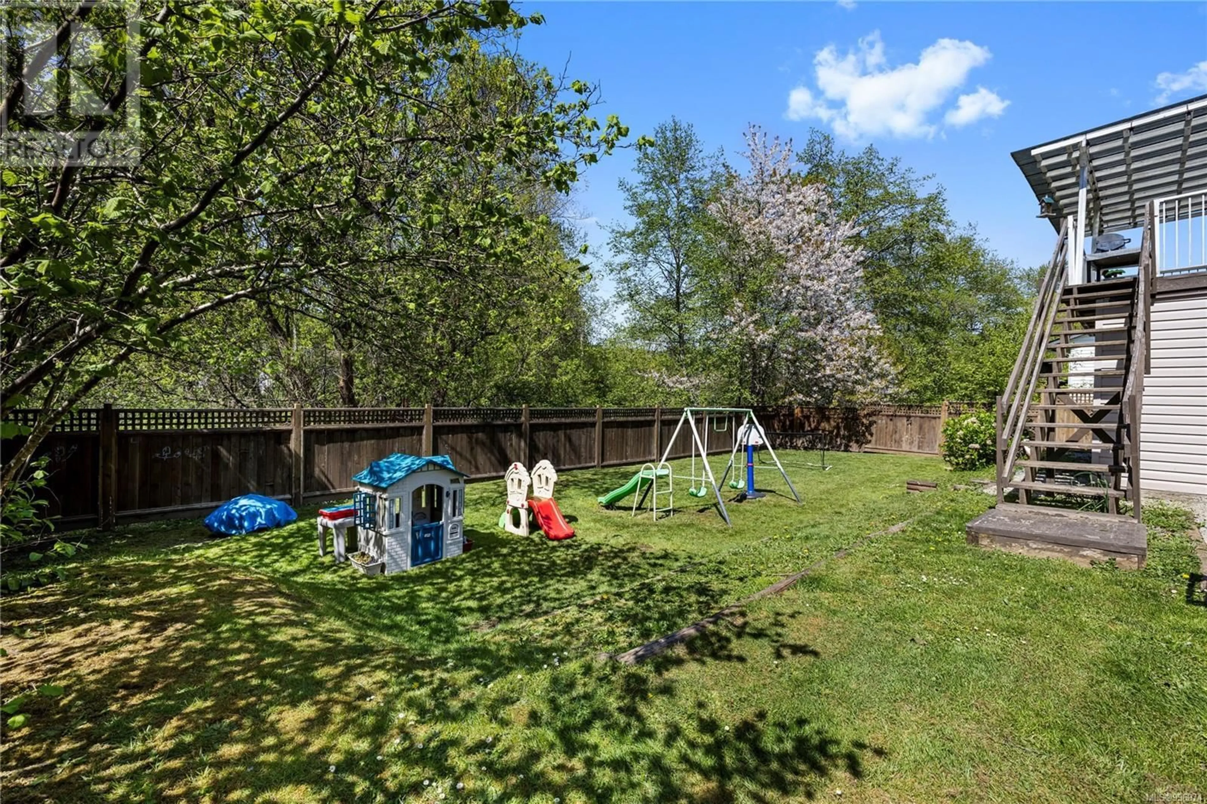 A pic from outside/outdoor area/front of a property/back of a property/a pic from drone, forest/trees view for 63 PORTER ROAD, Nanaimo British Columbia V9X1B6