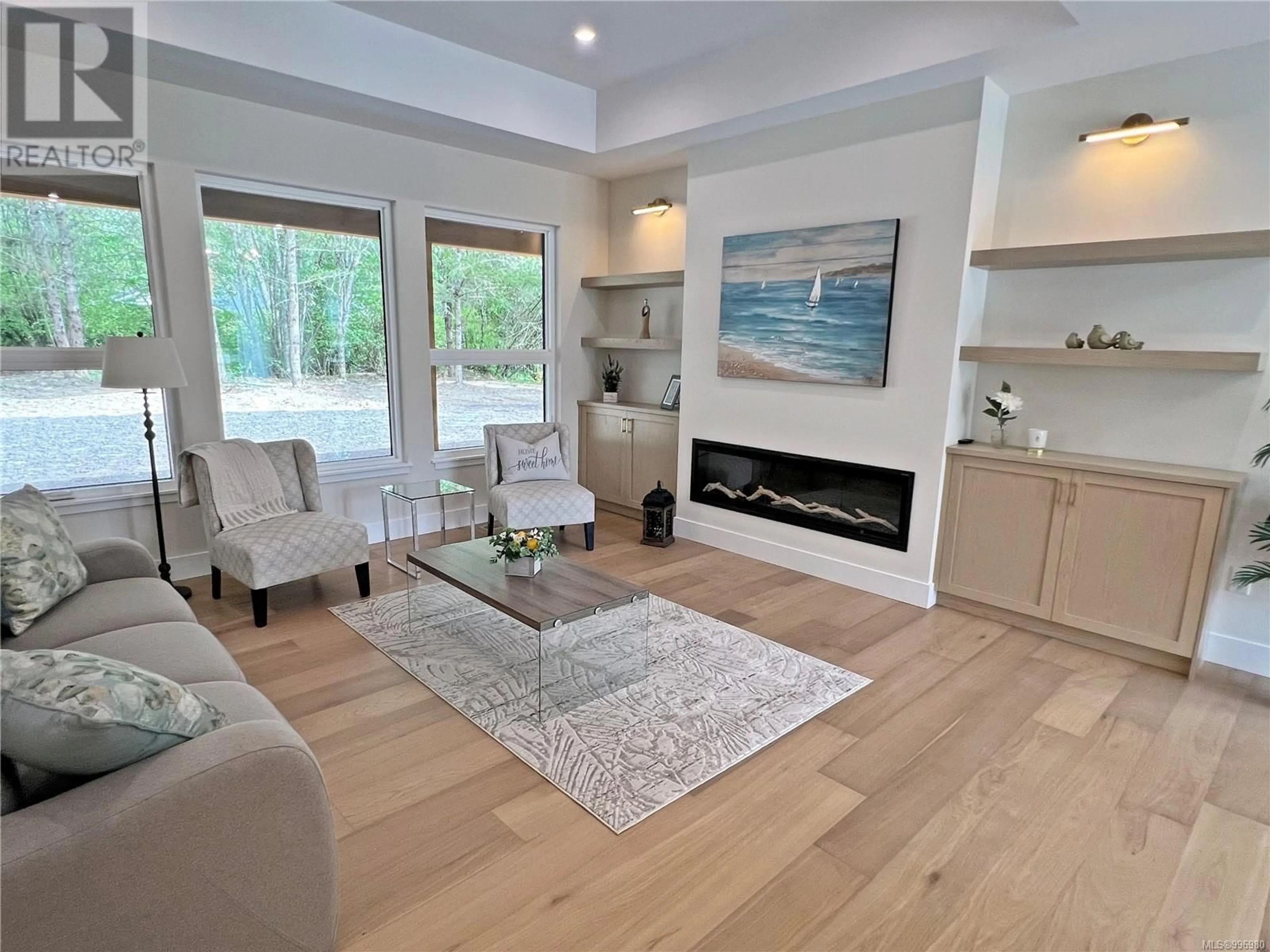 Living room with furniture, wood/laminate floor for 1936 WOOBANK ROAD, Nanaimo British Columbia V9X1G9