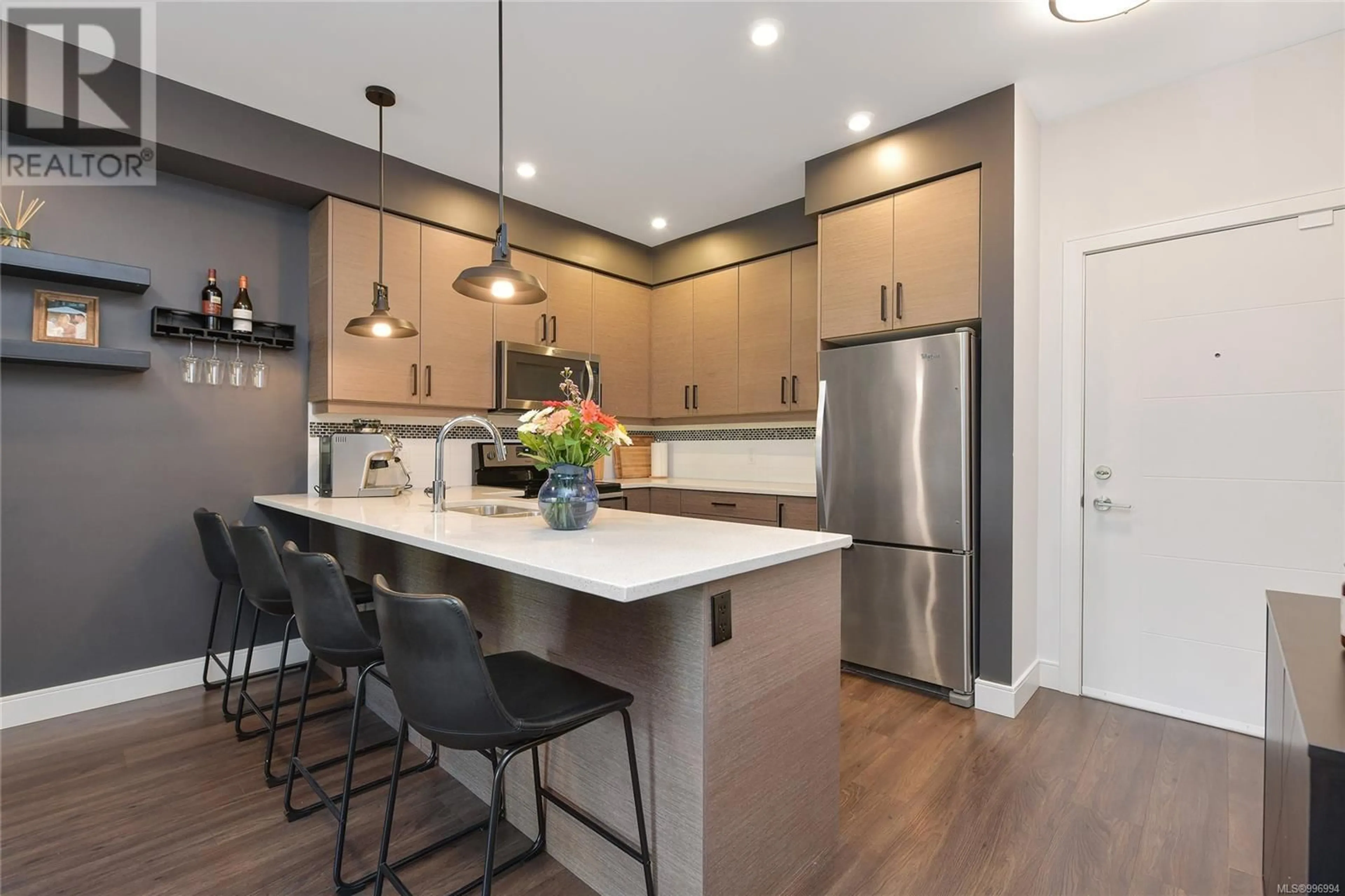 Open concept kitchen, wood/laminate floor for 302 - 7111 WEST SAANICH ROAD, Central Saanich British Columbia V8M1P7