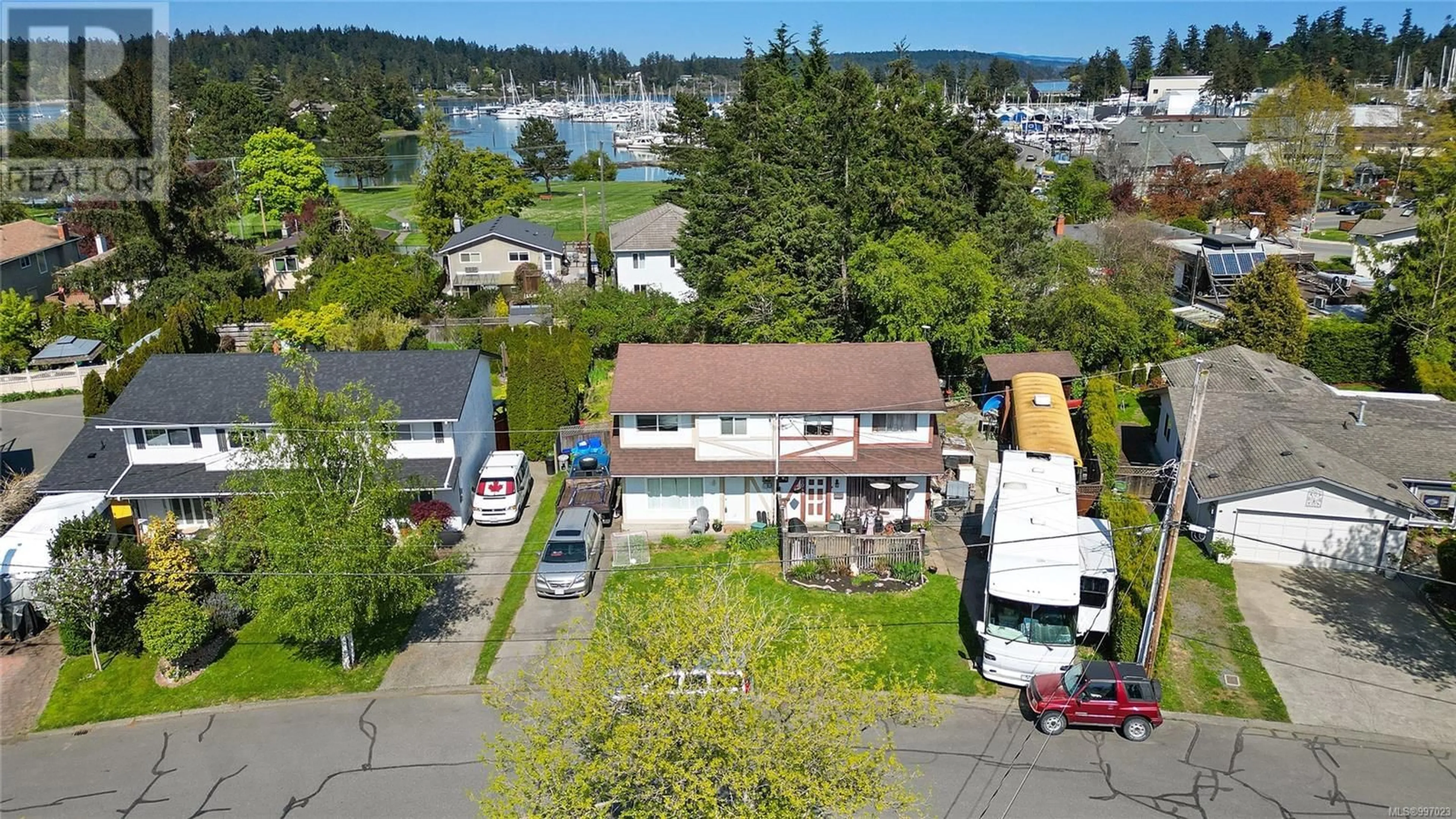 A pic from outside/outdoor area/front of a property/back of a property/a pic from drone, street for A - 2043 COURSER DRIVE, Sidney British Columbia V8L2N5