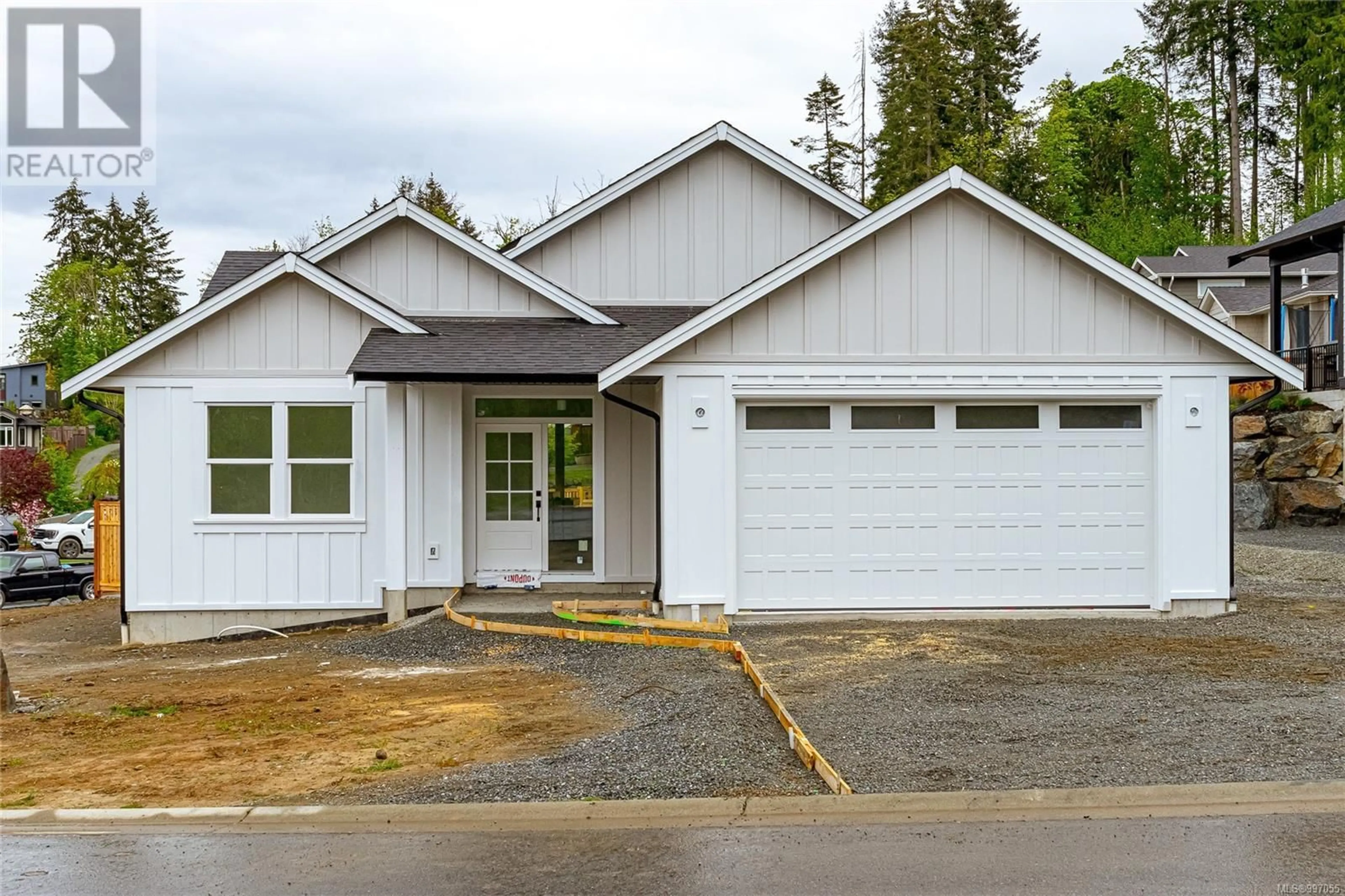 Home with vinyl exterior material, street for 1834 VEE ROAD, Cowichan Bay British Columbia V0R1N0