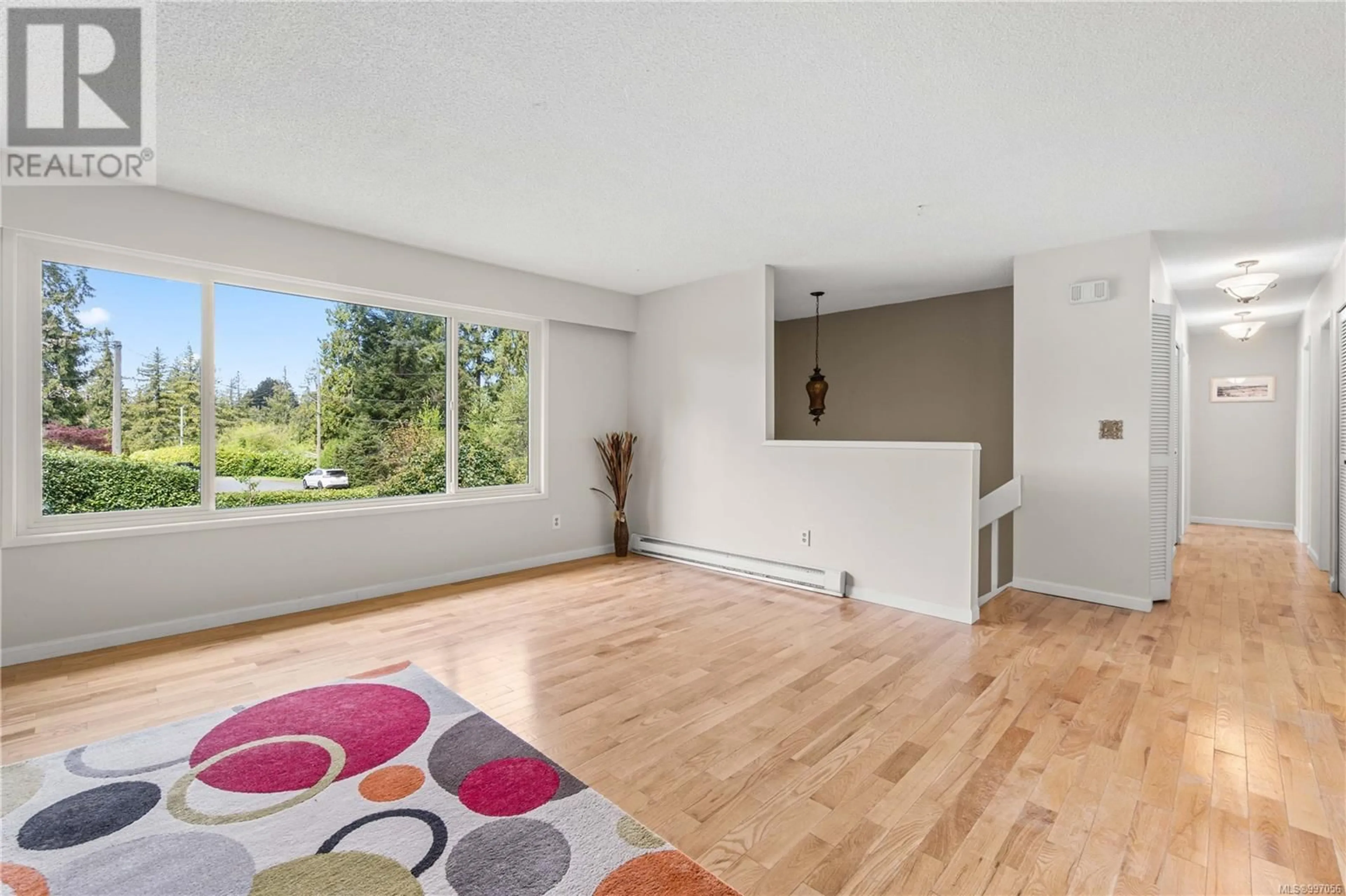 Living room with furniture, wood/laminate floor for 2749 JOANNA TERRACE, Nanaimo British Columbia V9T4V3