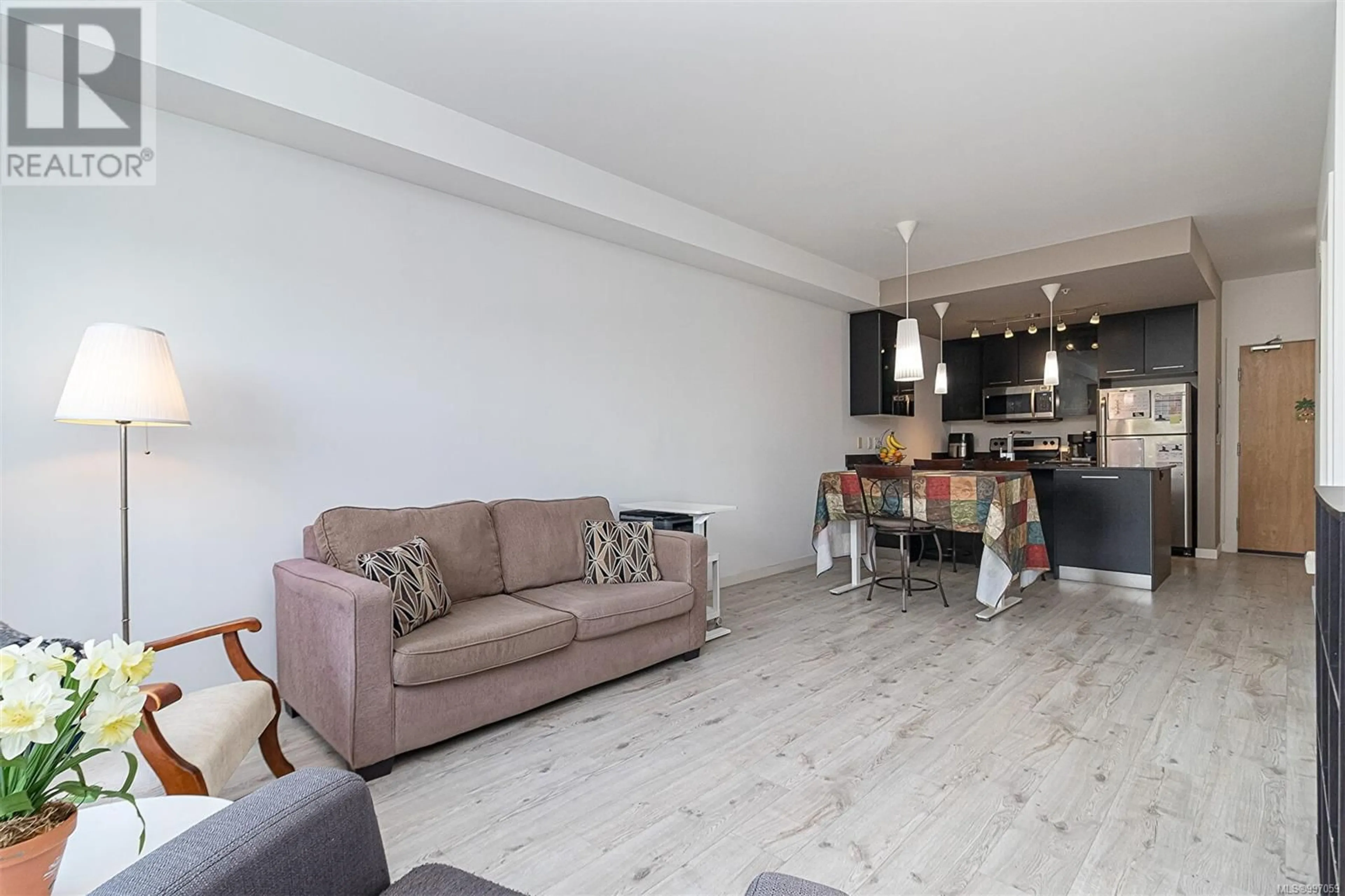 Living room with furniture, wood/laminate floor for 332 - 2871 JACKLIN ROAD, Langford British Columbia V9B0P3