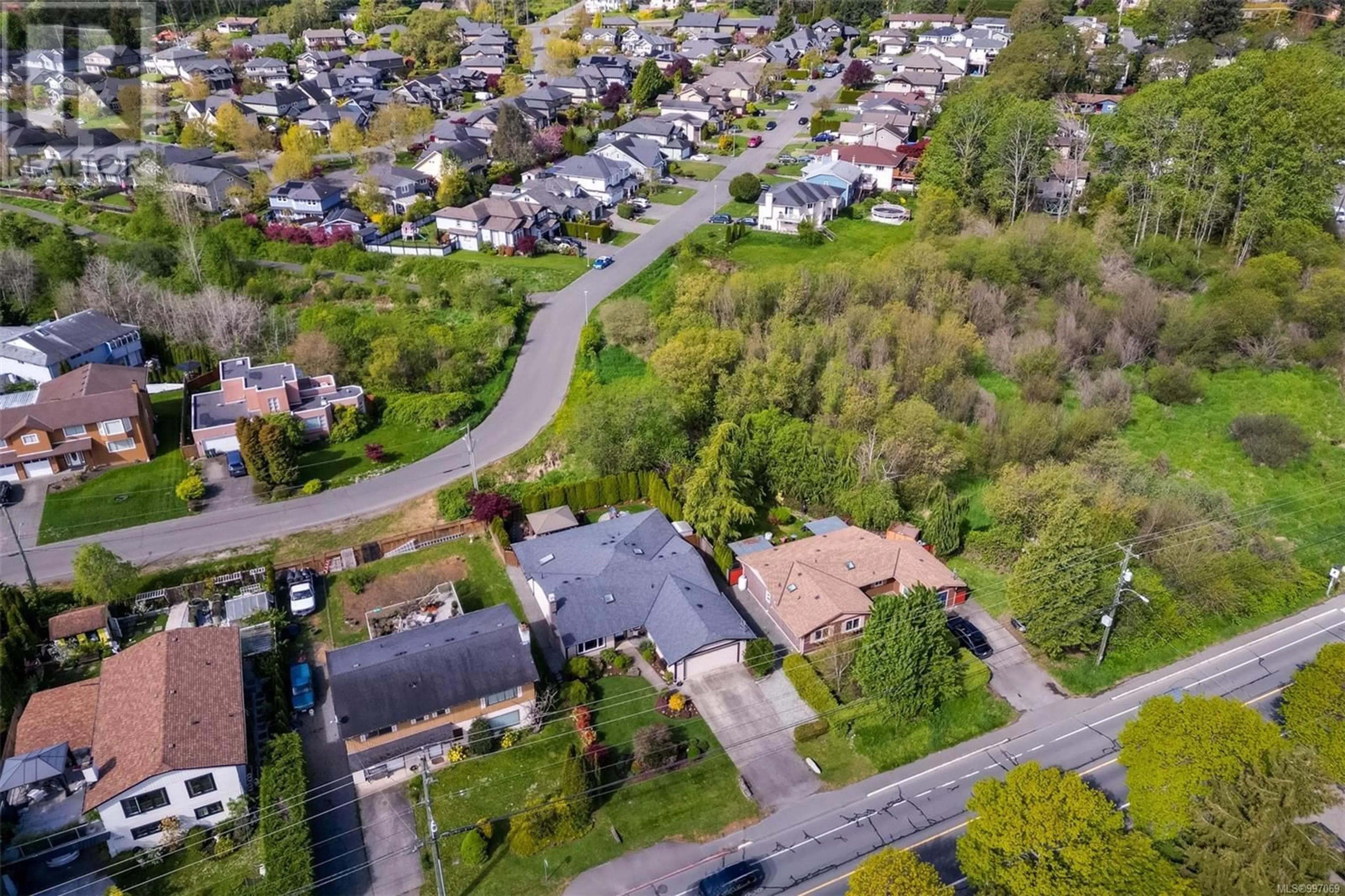 A pic from outside/outdoor area/front of a property/back of a property/a pic from drone, street for 4096 INTERURBAN ROAD, Saanich British Columbia V8Z4W7