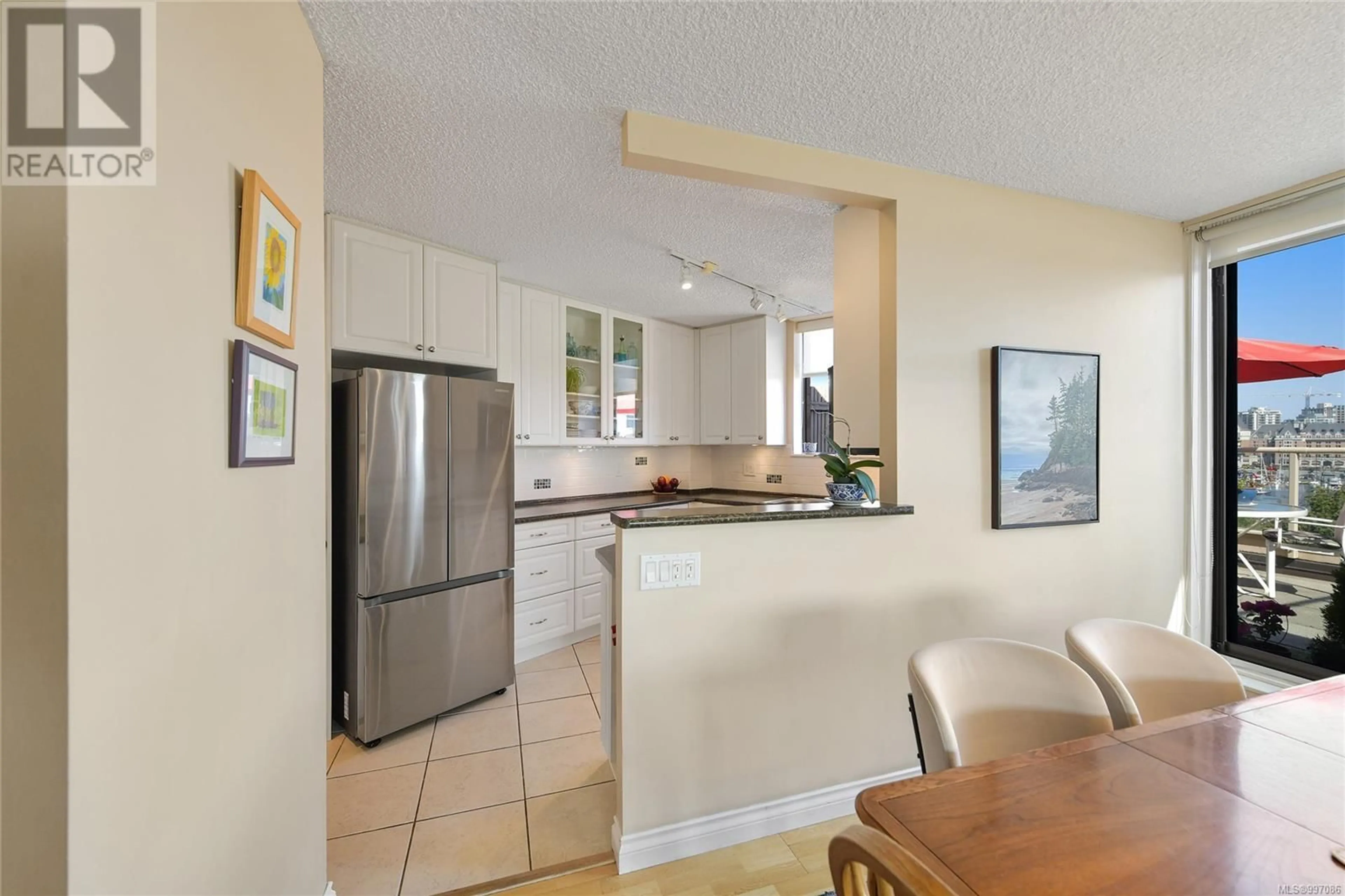 Open concept kitchen, ceramic/tile floor for 612 - 225 BELLEVILLE STREET, Victoria British Columbia V8V4T9