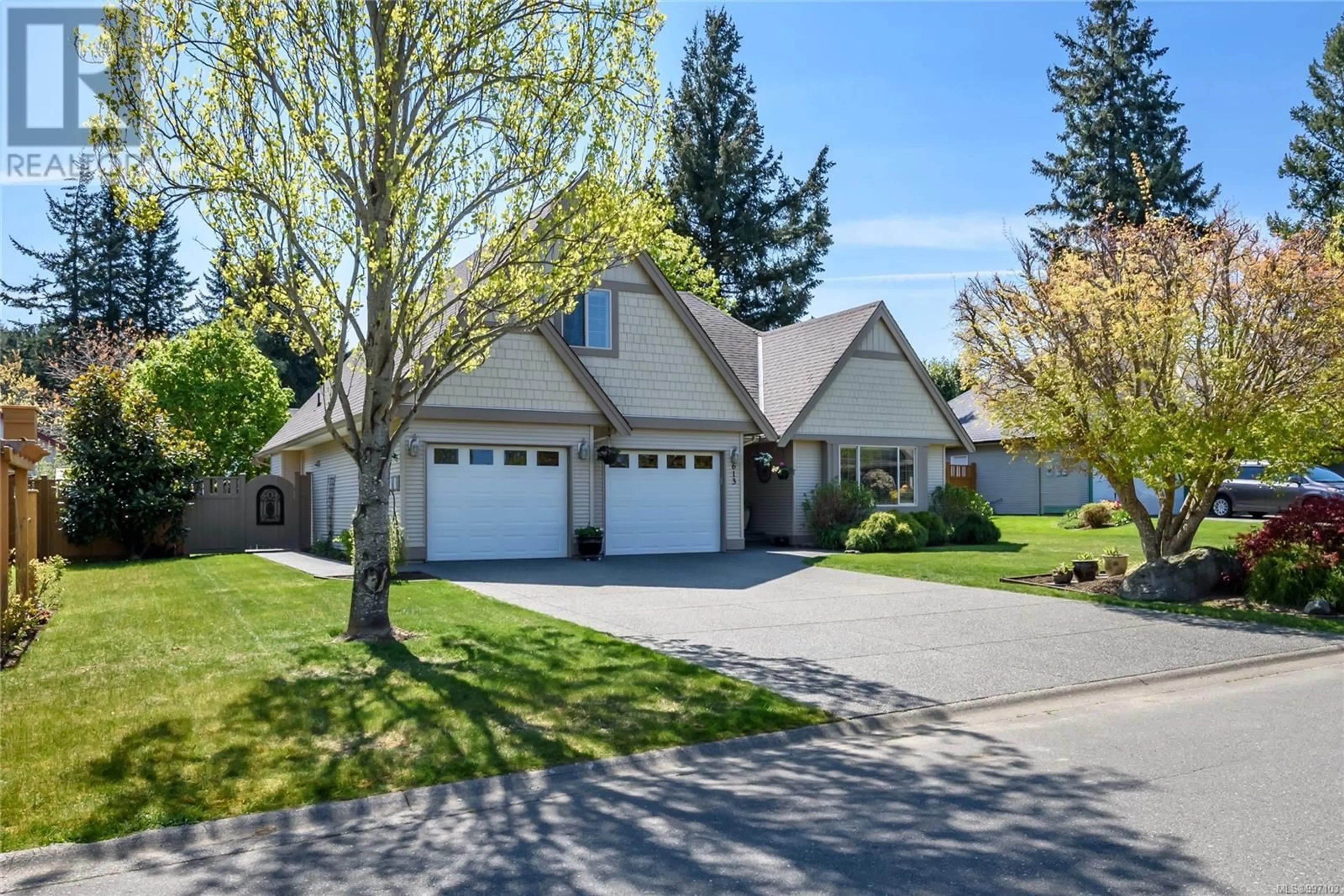 Home with vinyl exterior material, street for 613 OLYMPIC DRIVE, Comox British Columbia V9M4G6