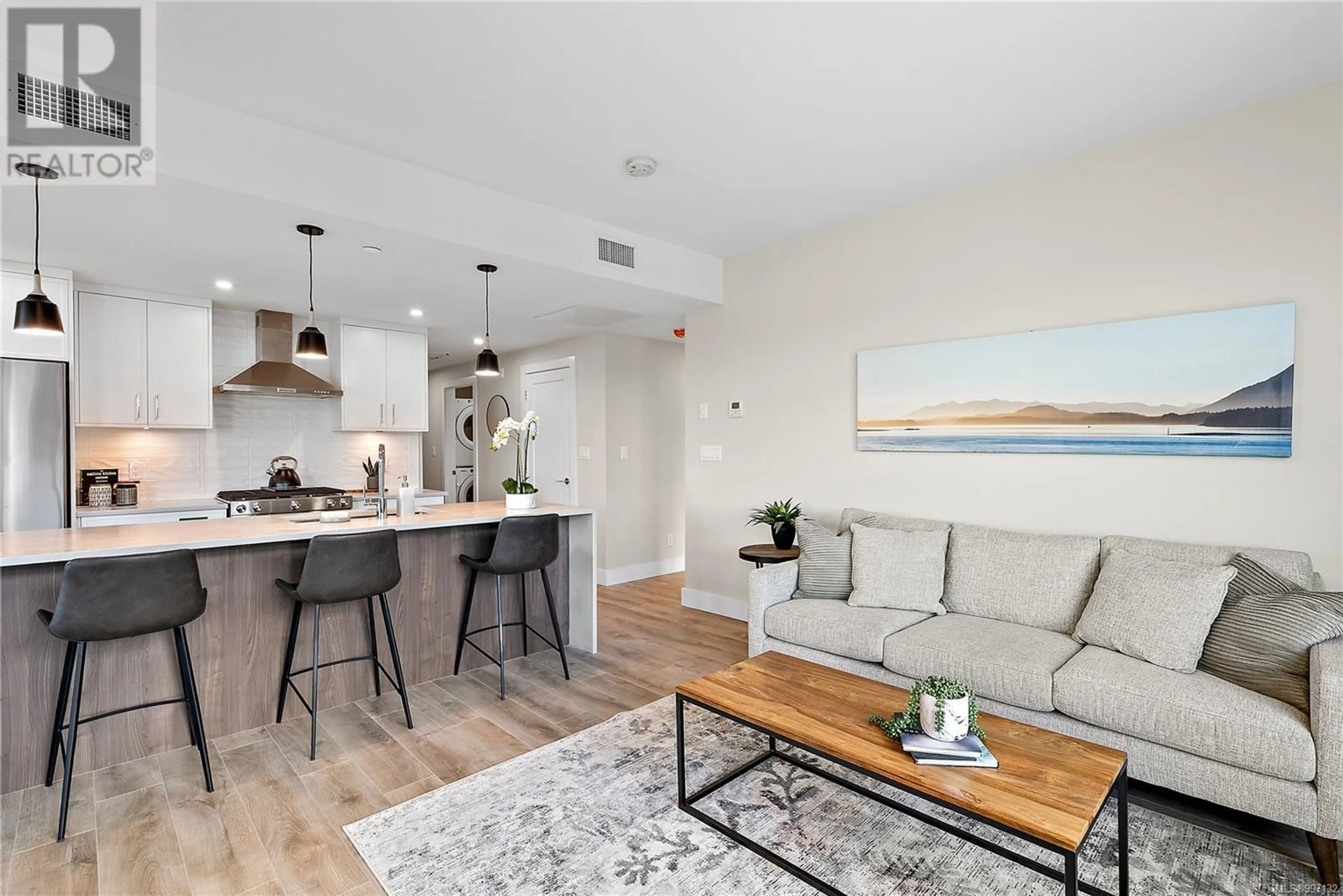 Open concept kitchen, wood/laminate floor for 604 - 2520 HACKETT CRESCENT, Central Saanich British Columbia V8M0B9