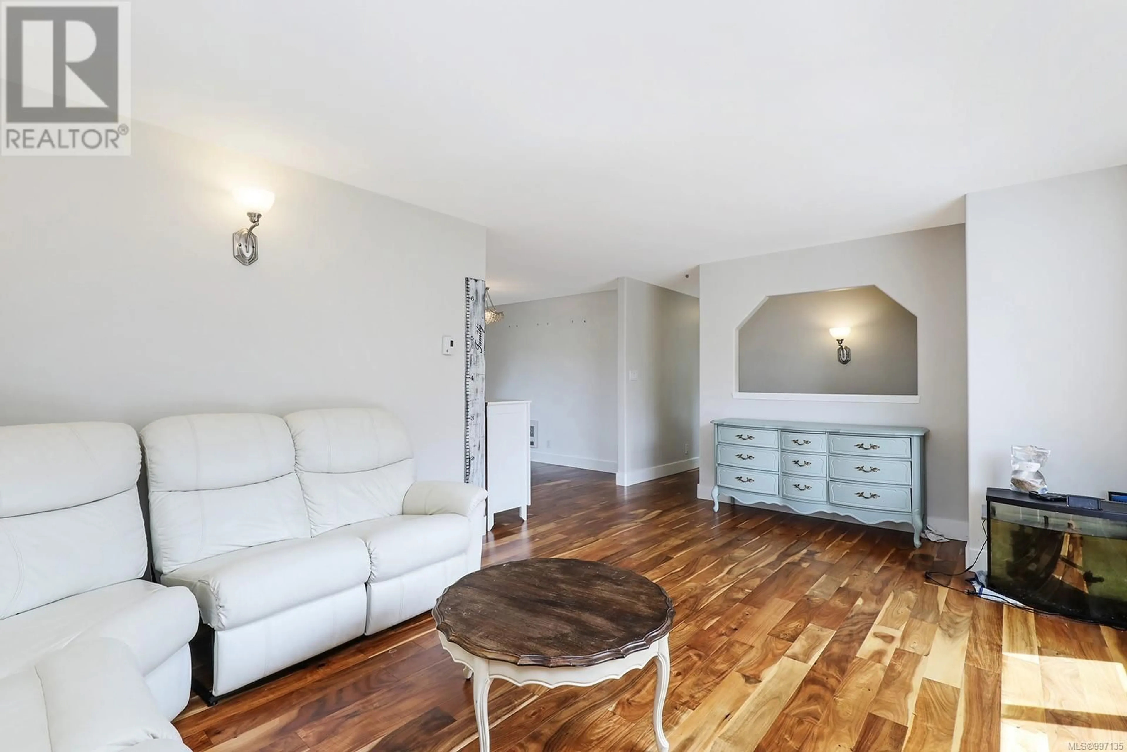 Living room with furniture, wood/laminate floor for 5252 HEADQUARTERS ROAD, Courtenay British Columbia V9N5M6