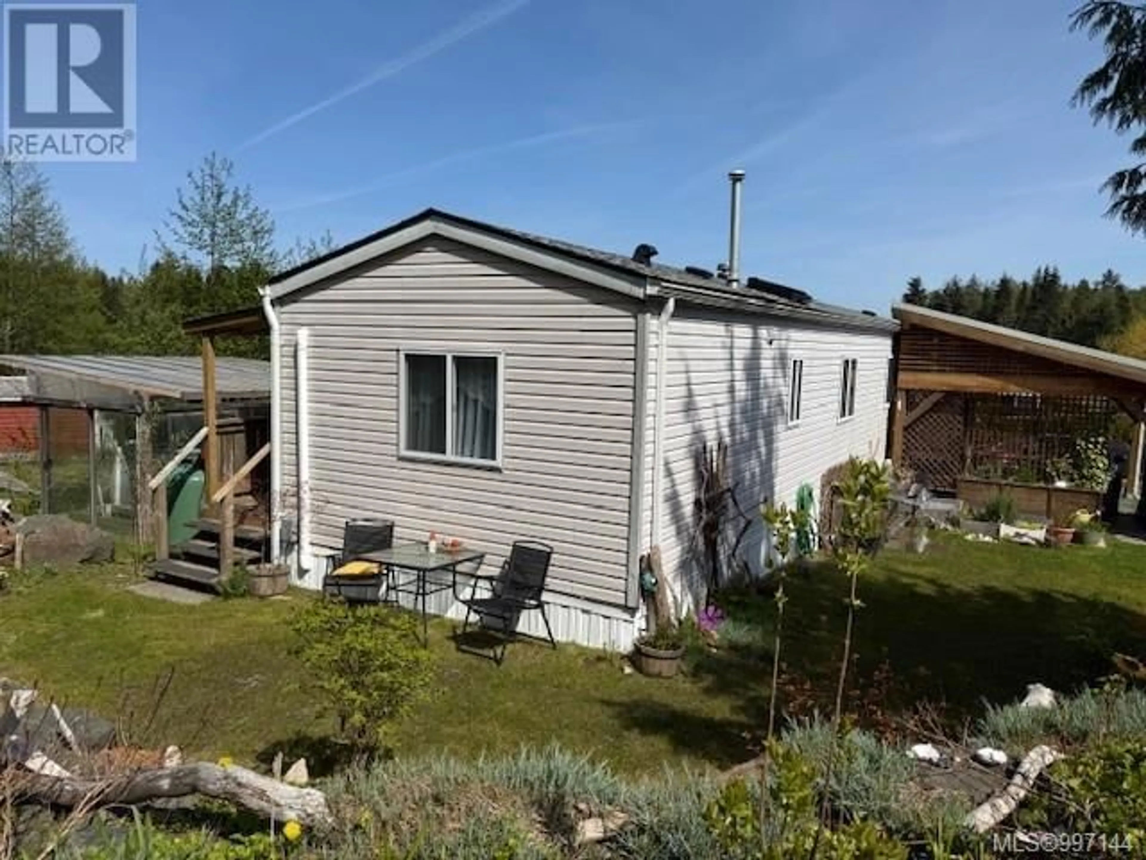 A pic from outside/outdoor area/front of a property/back of a property/a pic from drone, unknown for 34 - 5250 BEAVER HARBOUR ROAD, Port Hardy British Columbia V0N2P0