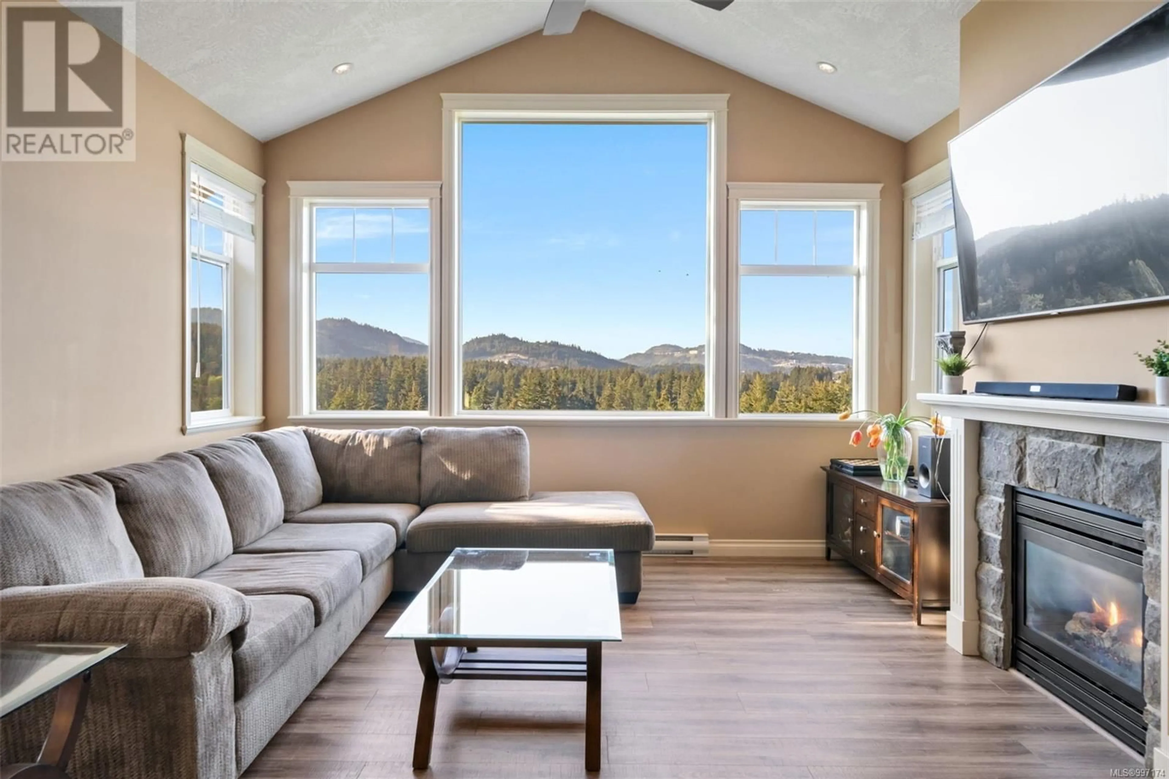 Living room with furniture, wood/laminate floor for 990 MOSS RIDGE CLOSE, Langford British Columbia V9C4M8