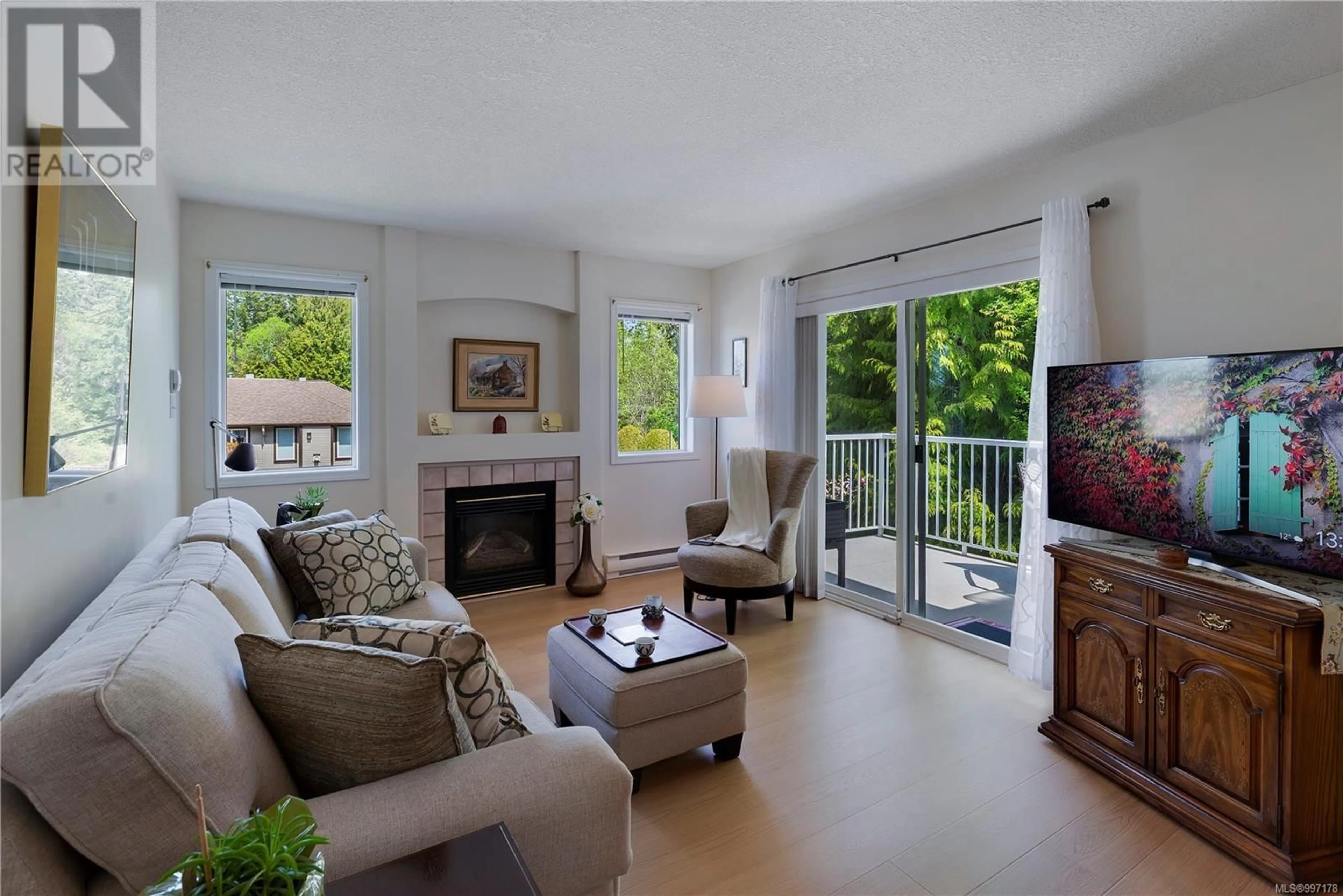 Living room with furniture, unknown for 205 - 440 SCHLEY PLACE, Qualicum Beach British Columbia V9K2M5
