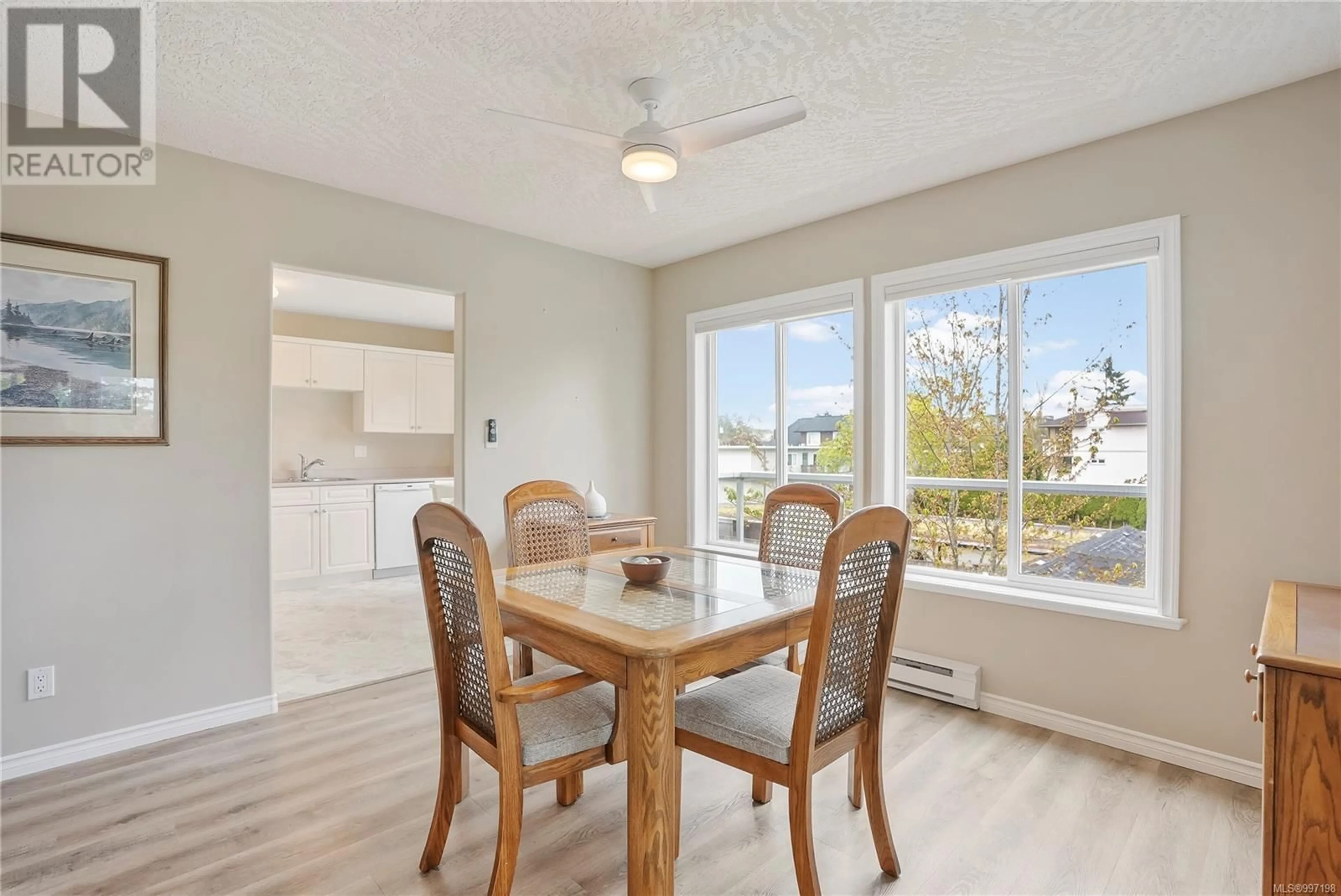 Dining room, wood/laminate floor for 301 - 9993 FOURTH STREET, Sidney British Columbia V8L1X3