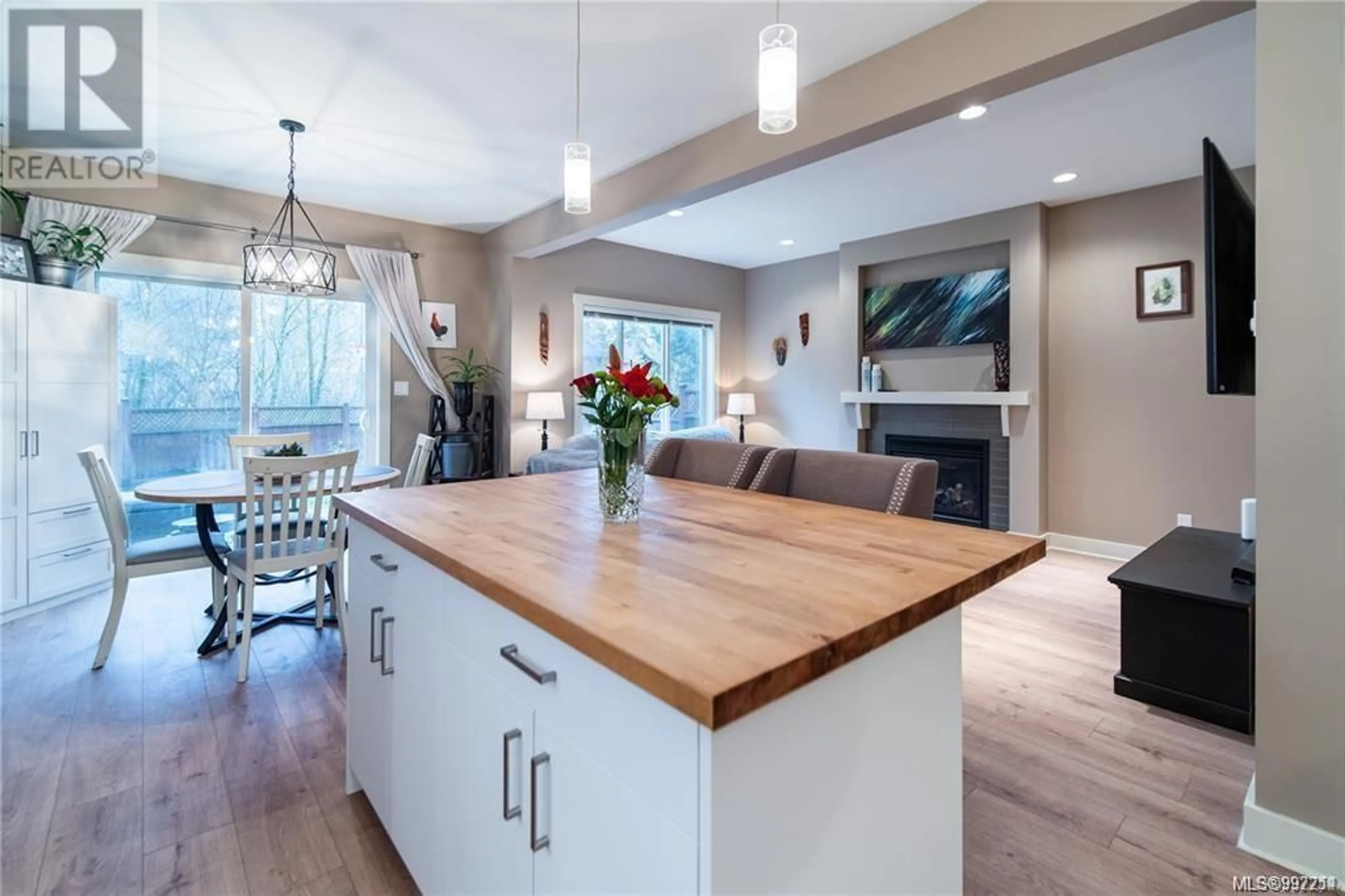 Open concept kitchen, wood/laminate floor for 1034 GALA COURT, Langford British Columbia V9C0J8