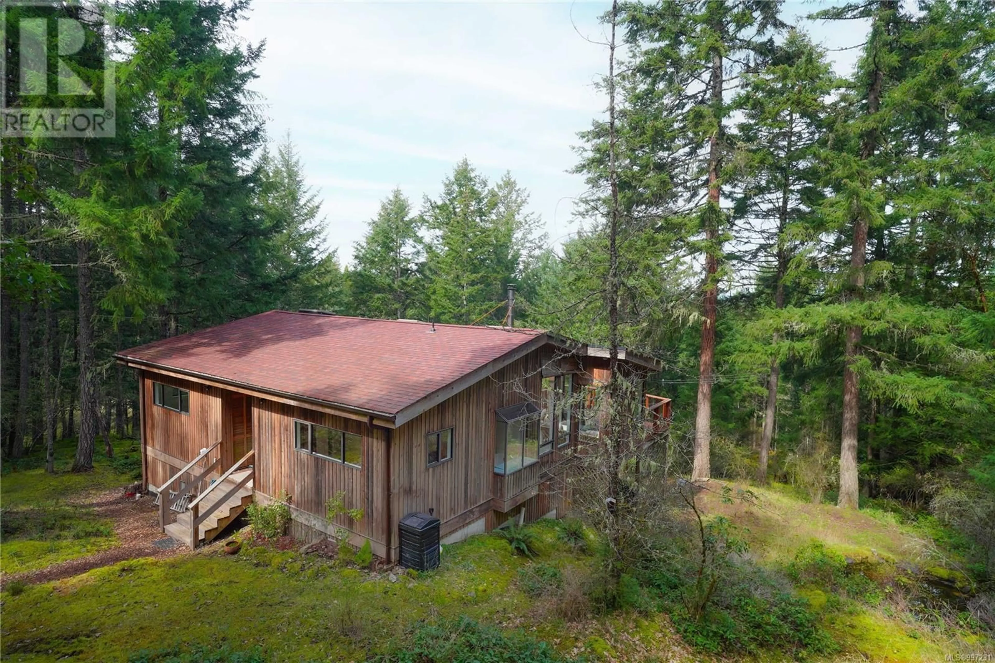A pic from outside/outdoor area/front of a property/back of a property/a pic from drone, forest/trees view for 631 MT. BELCHER HEIGHTS, Salt Spring British Columbia V8K2J3