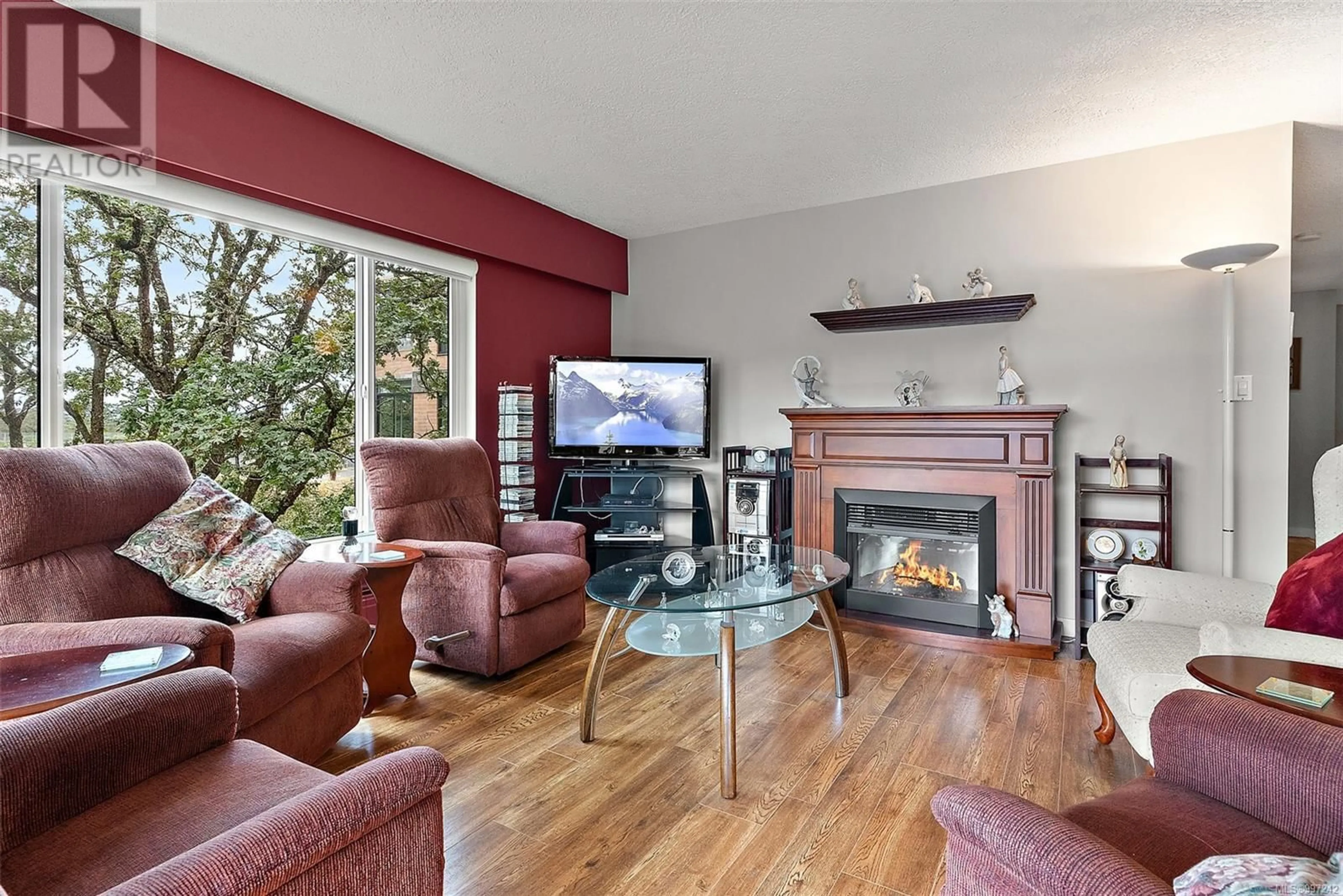 Living room with furniture, wood/laminate floor for 404 - 2920 COOK STREET, Victoria British Columbia V8T3S7