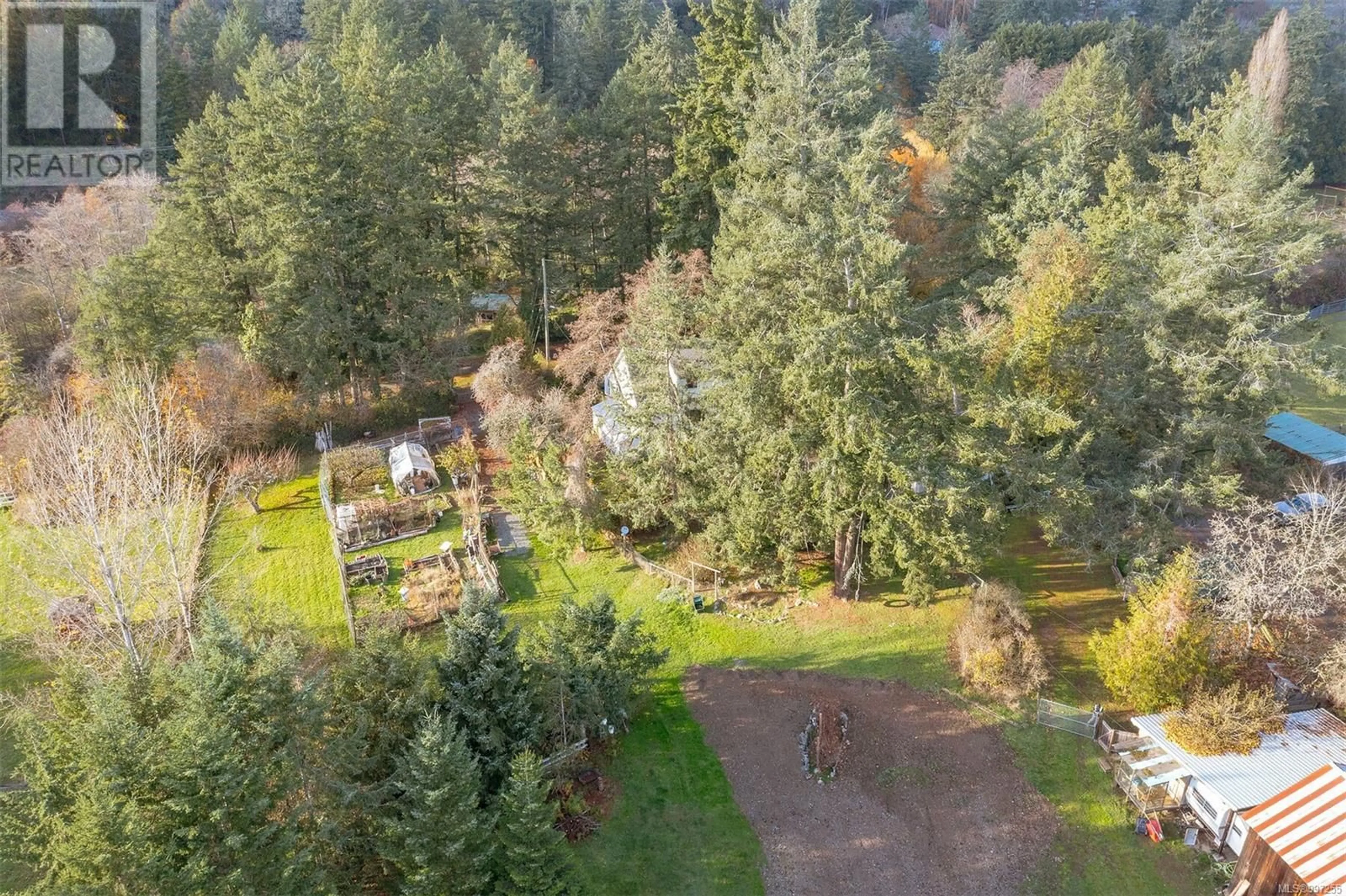 A pic from outside/outdoor area/front of a property/back of a property/a pic from drone, forest/trees view for 4797 ELK ROAD, Saanich British Columbia V9E2E6