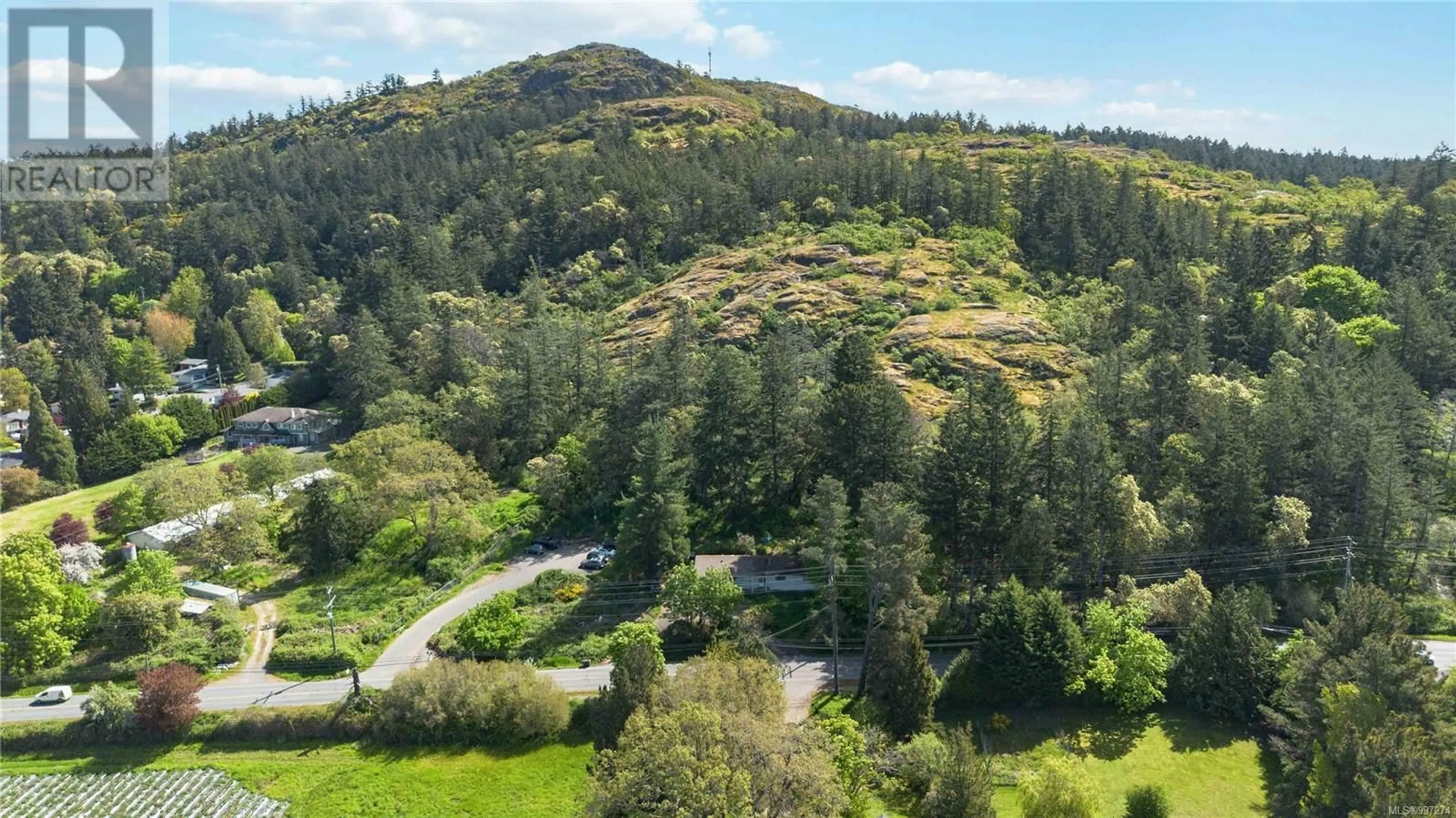 A pic from outside/outdoor area/front of a property/back of a property/a pic from drone, forest/trees view for 4439 BLENKINSOP ROAD, Saanich British Columbia V8X2C3