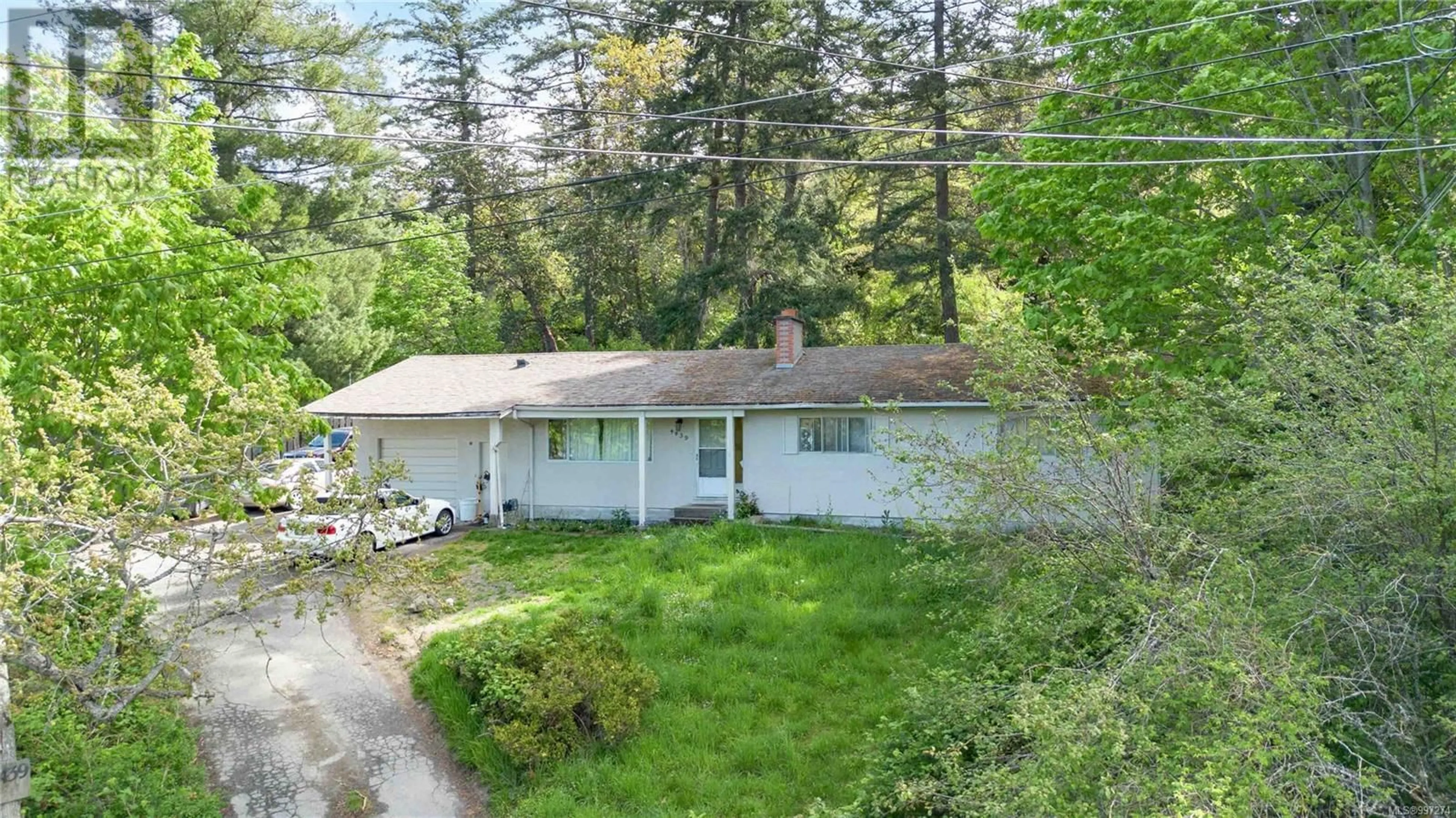 A pic from outside/outdoor area/front of a property/back of a property/a pic from drone, street for 4439 BLENKINSOP ROAD, Saanich British Columbia V8X2C3