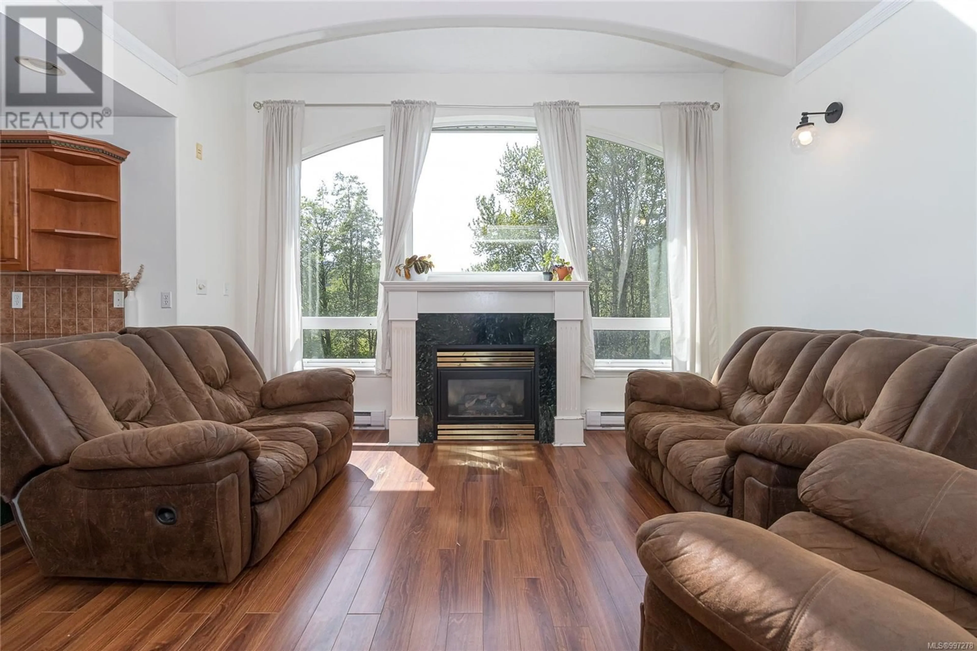Living room with furniture, wood/laminate floor for 3226 LOLEDO PLACE, Langford British Columbia V9C3W6