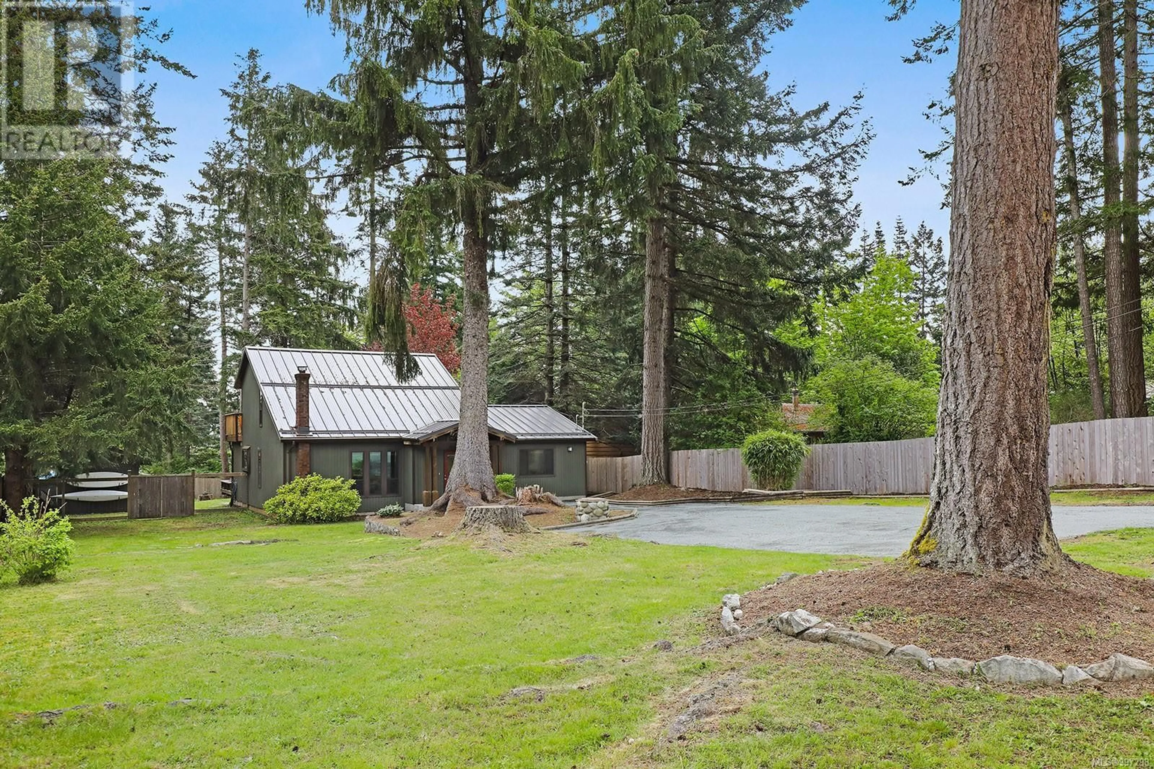 A pic from outside/outdoor area/front of a property/back of a property/a pic from drone, forest/trees view for 5868 BATES ROAD, Courtenay British Columbia V9J1W6
