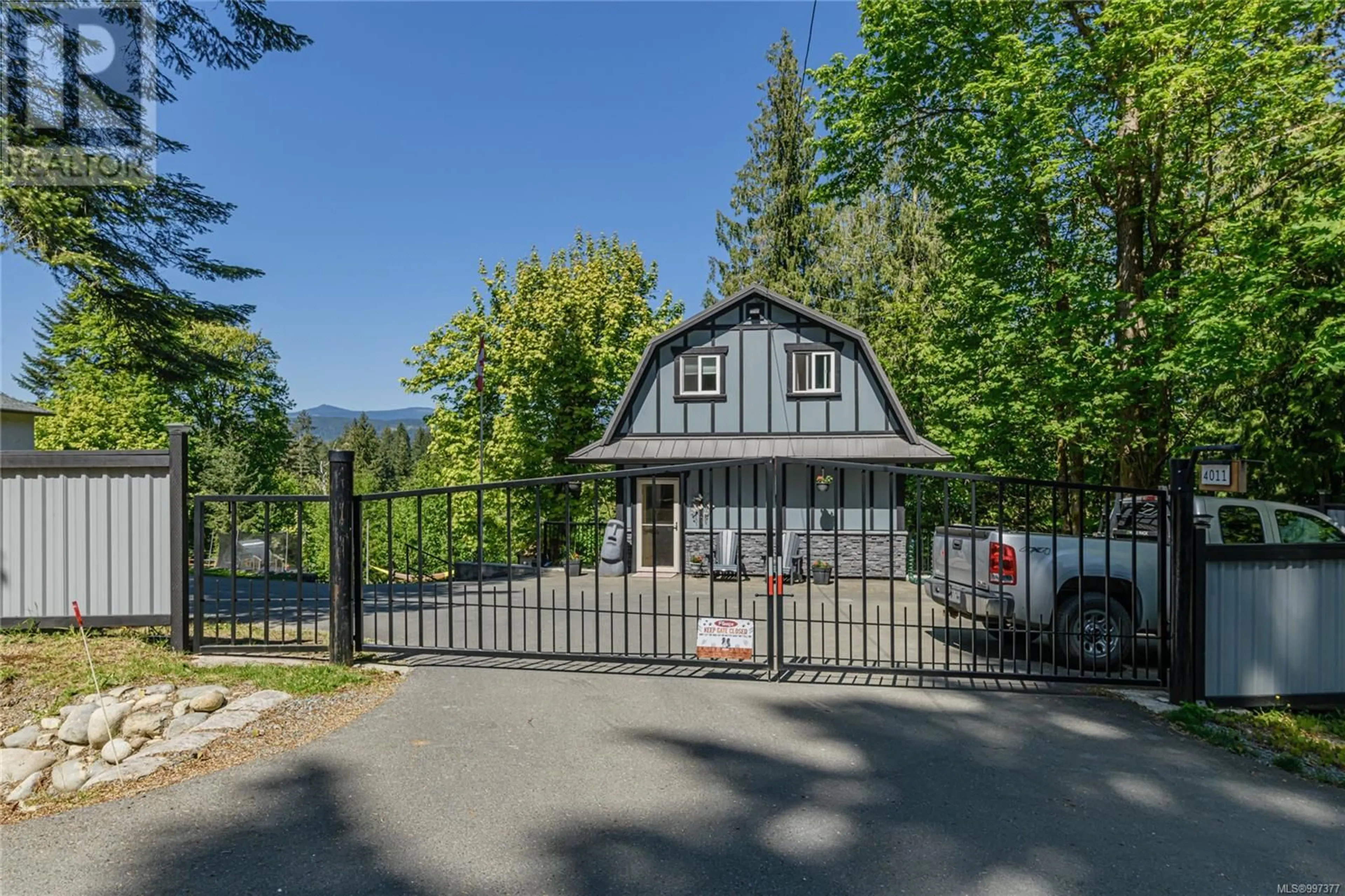 A pic from outside/outdoor area/front of a property/back of a property/a pic from drone, mountain view for 4011 CAMBRAI ROAD, Duncan British Columbia V9L6G1