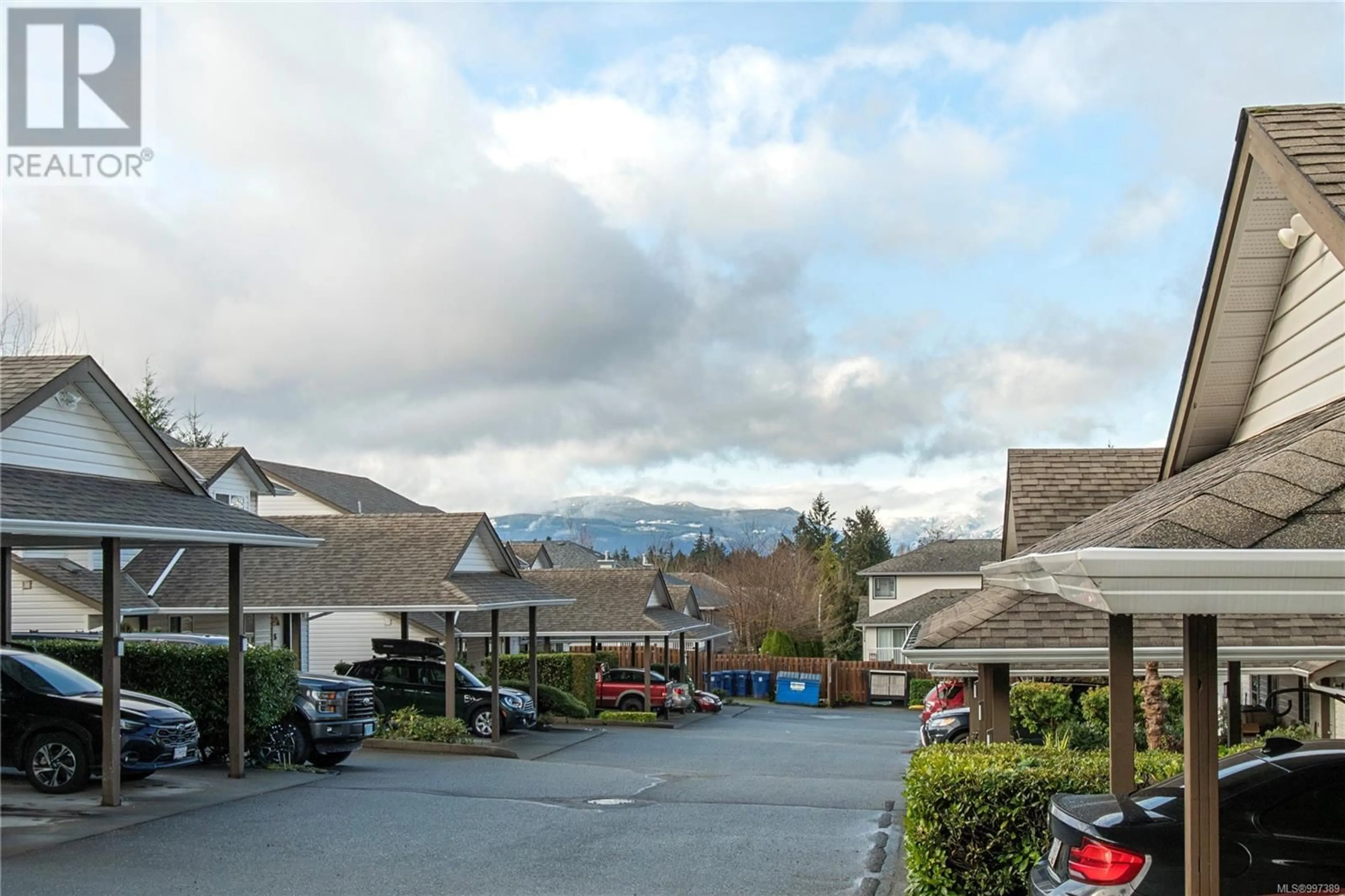 A pic from outside/outdoor area/front of a property/back of a property/a pic from drone, mountain view for 8 - 2625 MUIR ROAD, Courtenay British Columbia V9N8S6